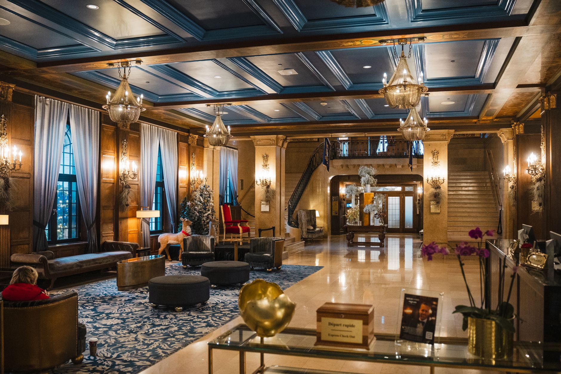 Sunlit historic hotel lobby with marble floors and tall windows, the kind of preserved interior where AMR routes must respect narrow guest paths.