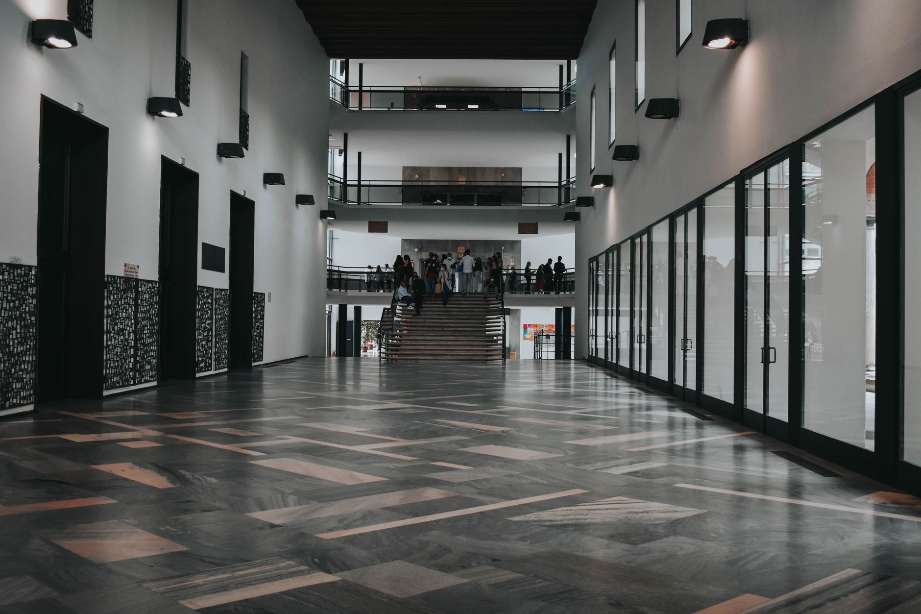 Sunlit terrazzo lobby in a public building where overnight floor care must protect polished stone.