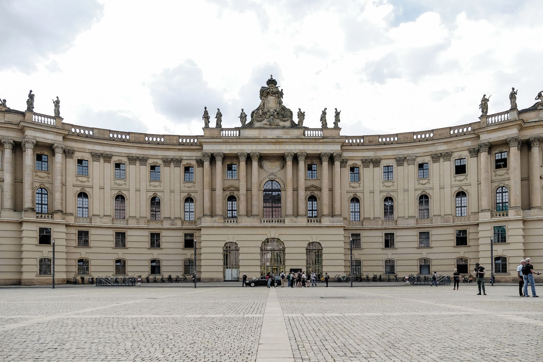 A close-up view of a historic university building's stone facade, highlighting intricate details and the kind of delicate surfaces that benefit from non-invasive drone inspections.