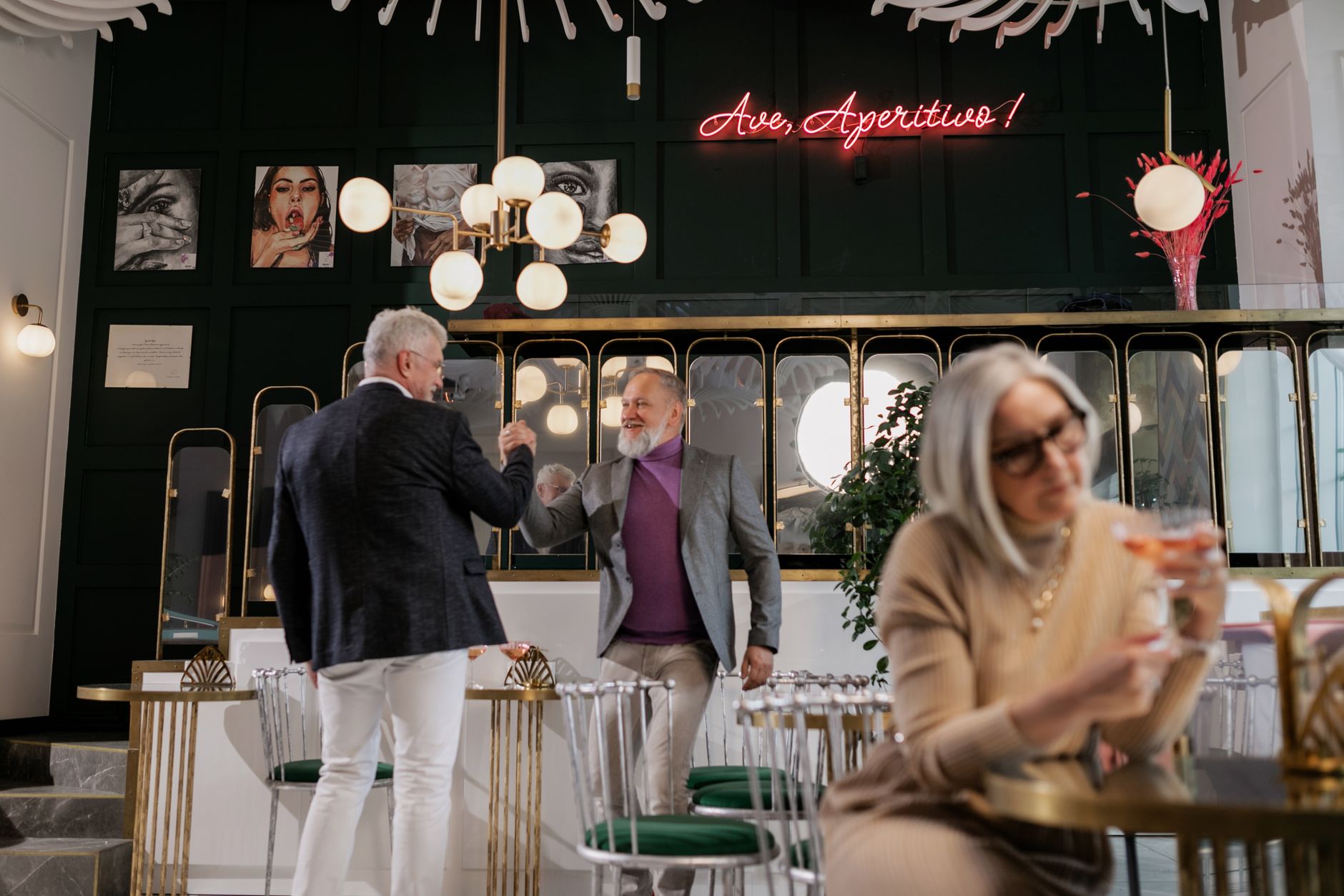 Residents chat together in a comfortable common area, showing the human interaction enabled by staff having more time.