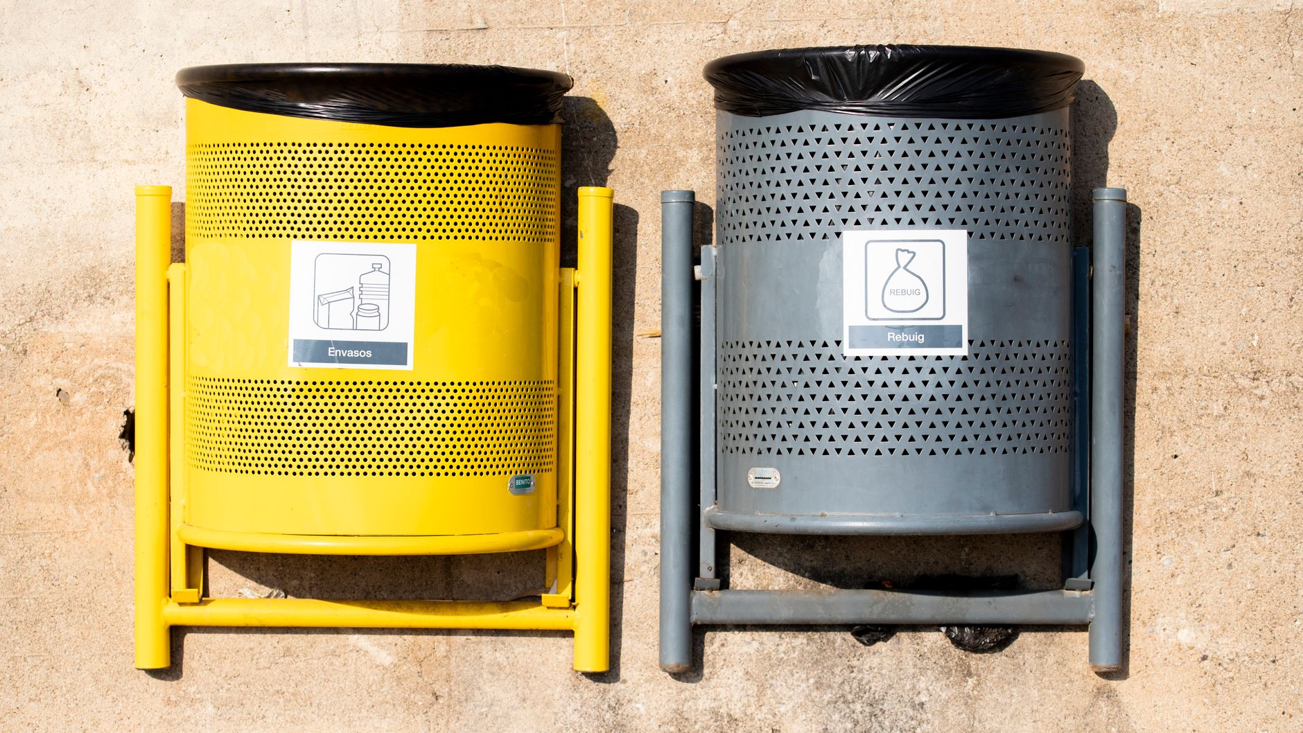 A back-of-house utility area with clearly separated bins and carts, reflecting the controlled waste routes described for a small imaging center.