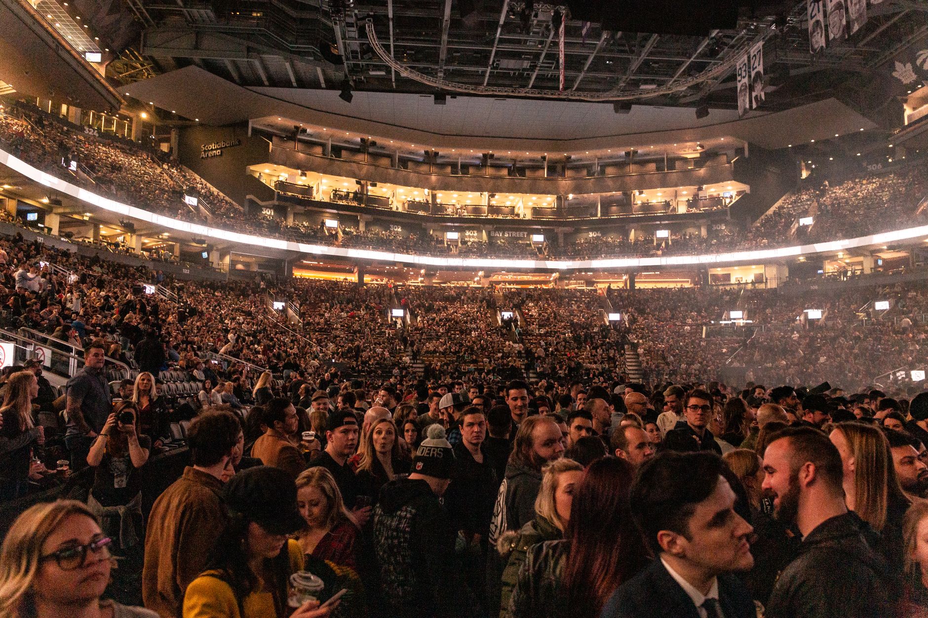 Busy stadium concourse filled with event attendees