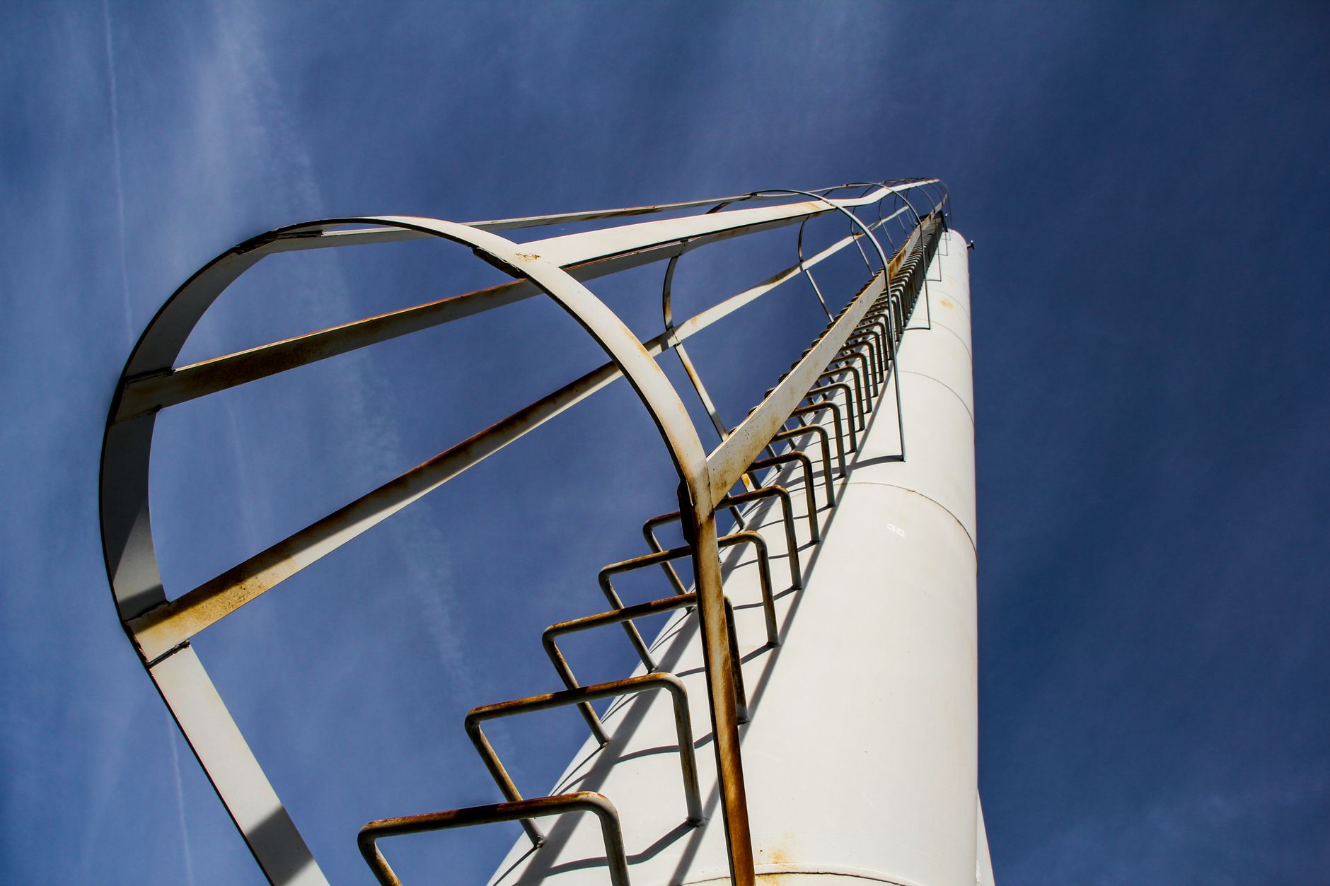 Maintenance access at height, echoing monorail service needs above a paint line.