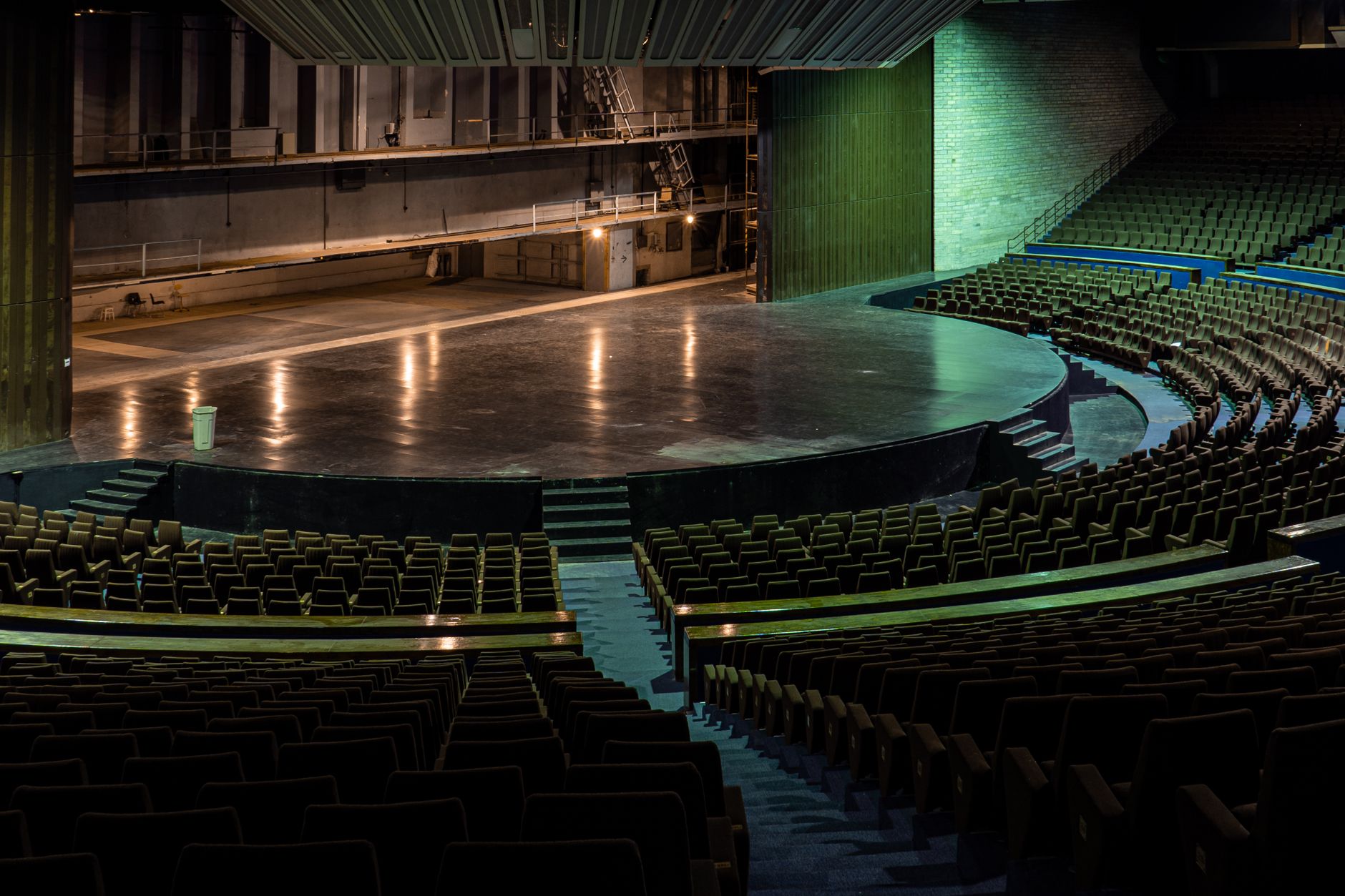 An empty theater stage and house during a dark hour when backstage supply moves can be scheduled.