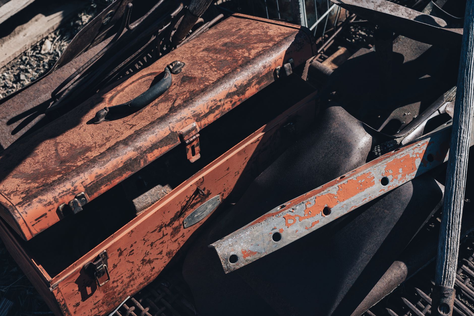 Contained metal scrap bin staged near a machining cell for pickup.