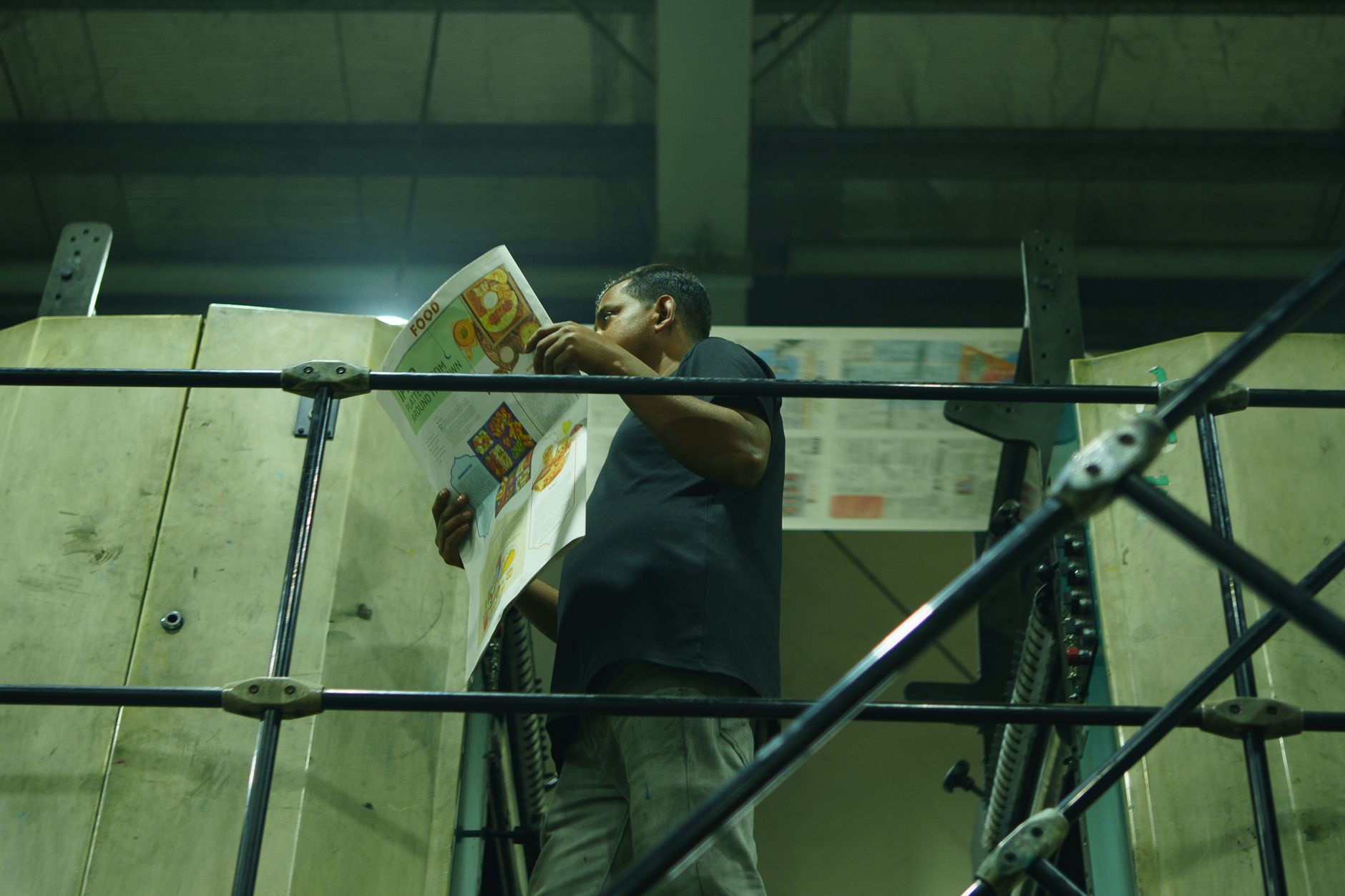 Industrial printing area with presses and wide aisles for material movement.