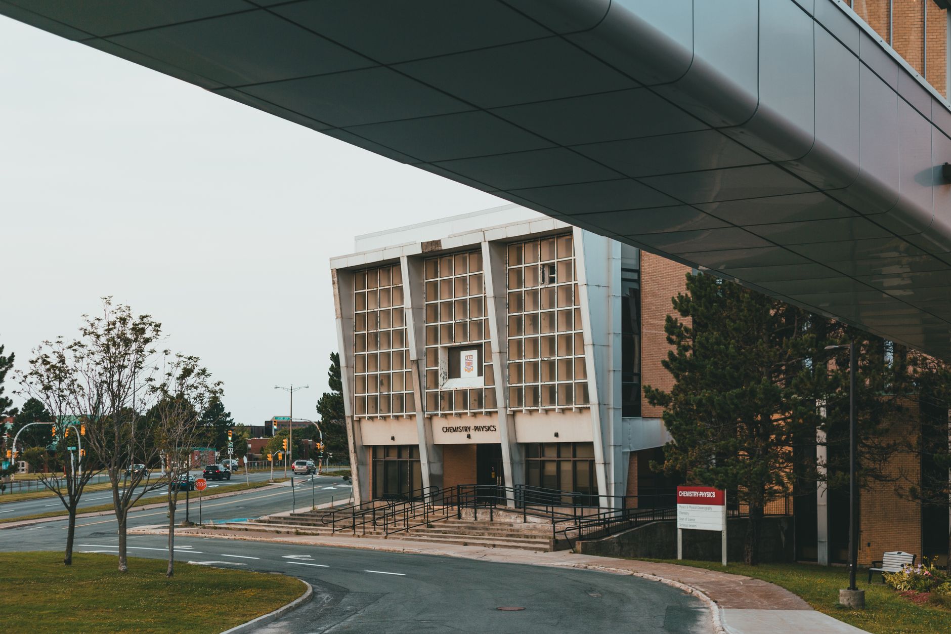Modern research buildings connected by a pedestrian path, matching the kind of short inter-building biotech campus runs discussed in the article.