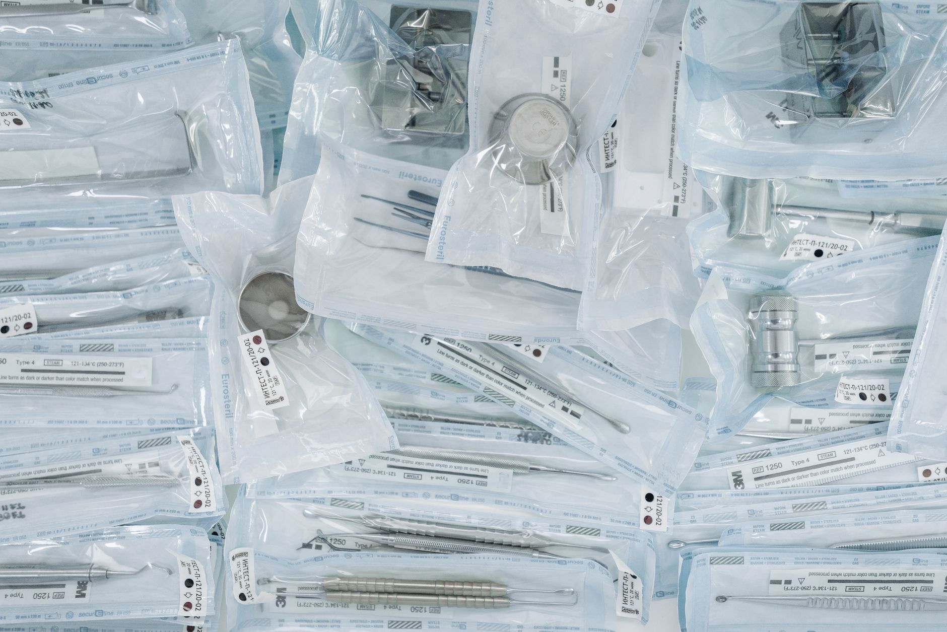 Sealed surgical supplies prepared for an integrity check before entering a restricted operating area.