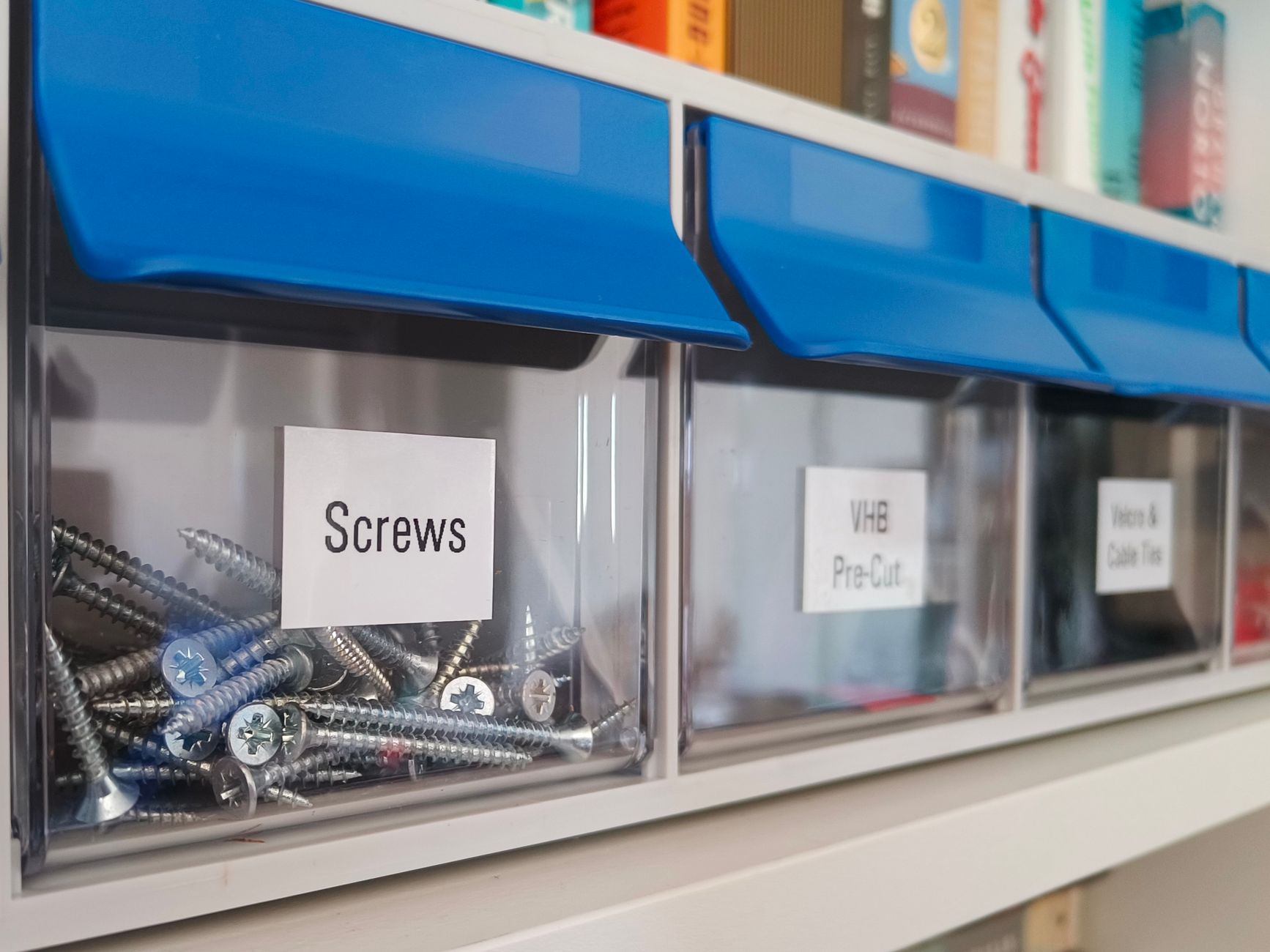 Shelves of small industrial parts illustrate the assortment and irregular demand that complicate MRO replenishment.