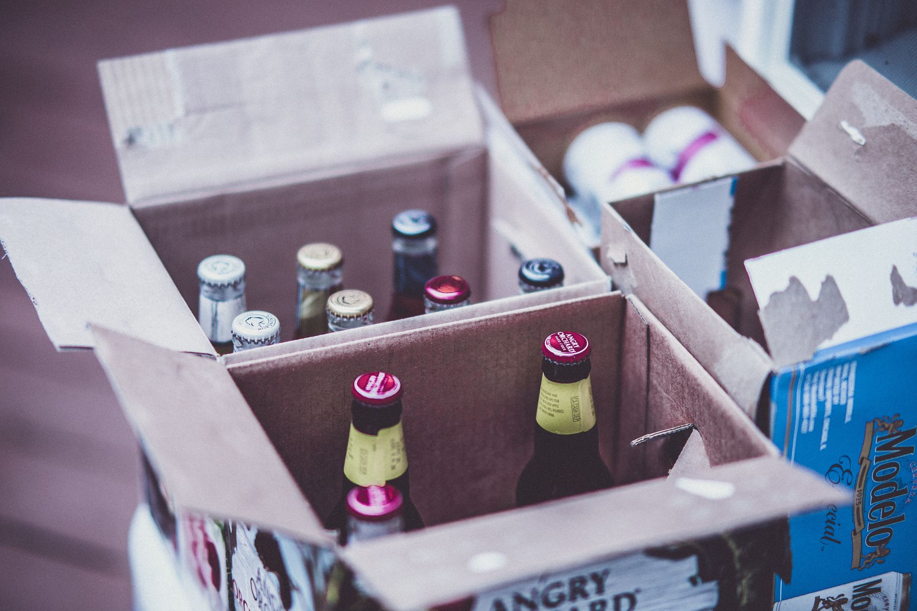 A close-up view of dozens of sealed beverage bottles, highlighting the importance of cap and seal integrity in quality control.