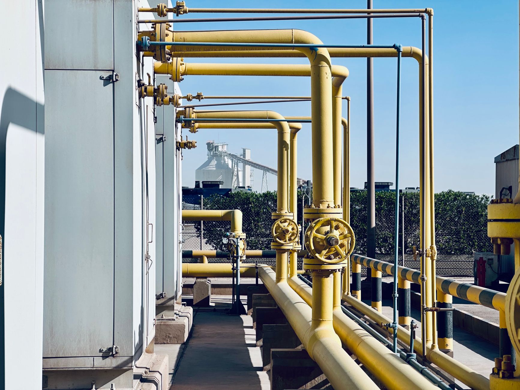 A network of industrial pipes and valves where an acoustic imager payload can pinpoint costly compressed air leaks.