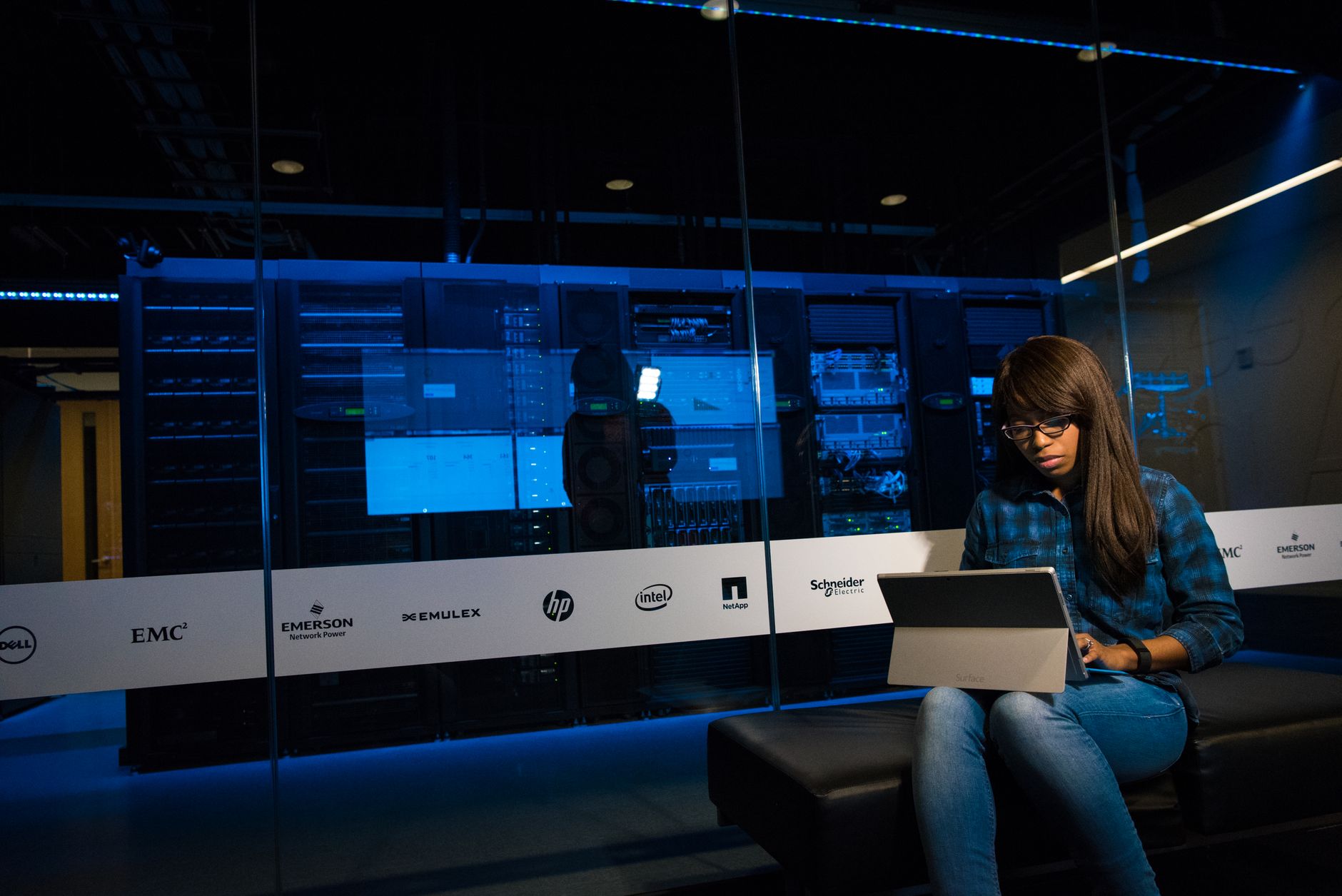 A darkened server room with rows of racks, illustrating a high-value facility that benefits from overnight robotic audits.