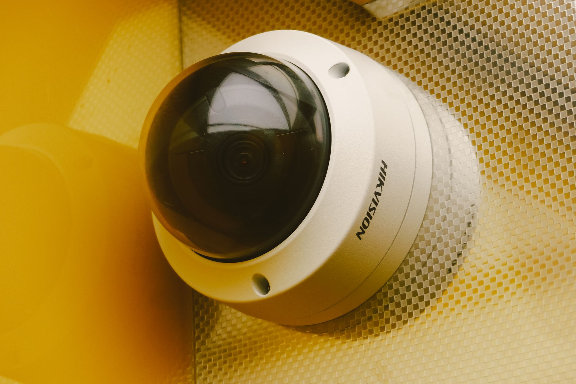 A close-up of a high-definition security camera lens, representing the advanced sensors used by patrol robots.