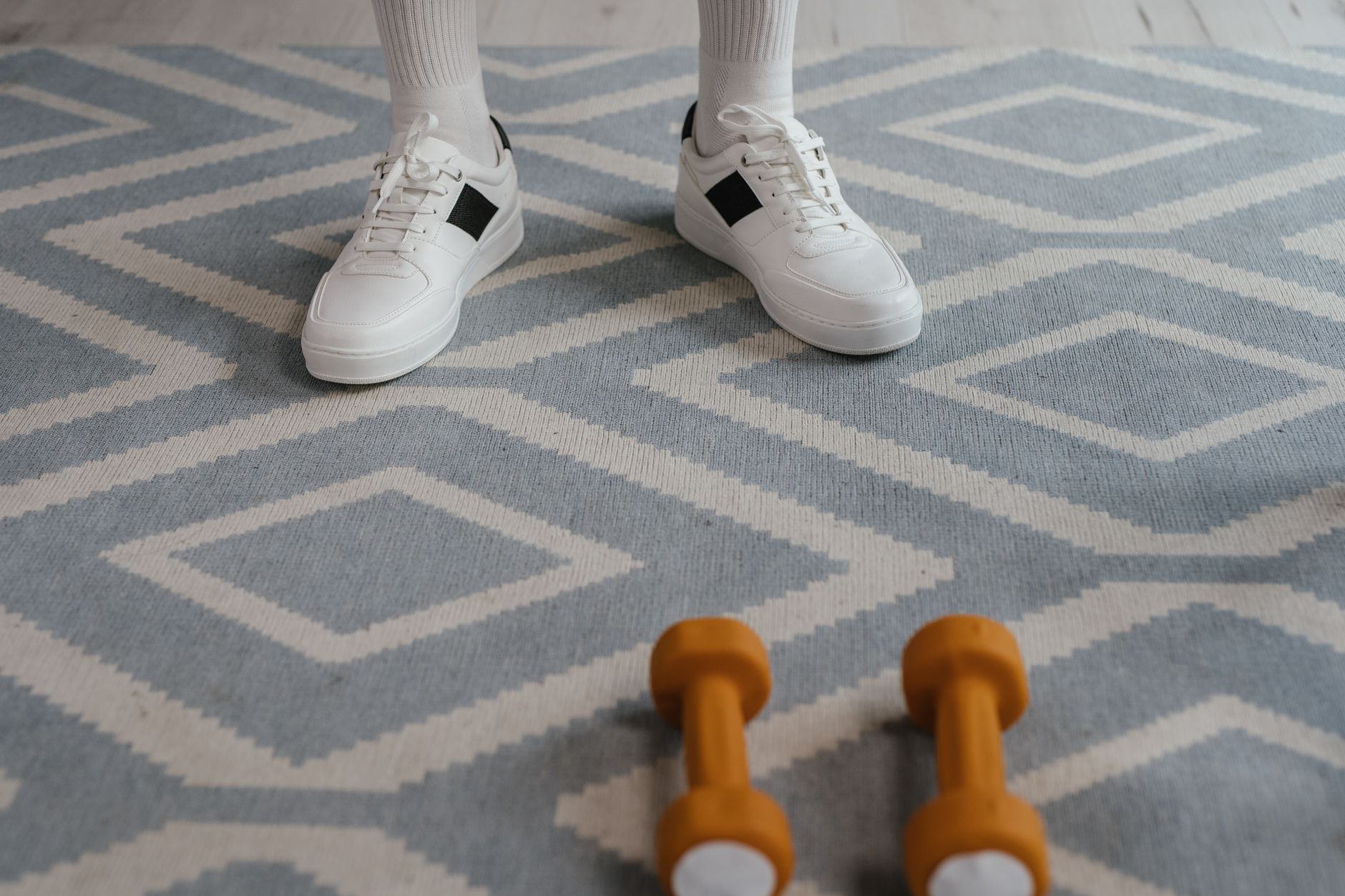 Entry carpet meeting rubber flooring in a gym shows the mixed surfaces that make one-machine cleaning promises hard to trust in a climbing facility.