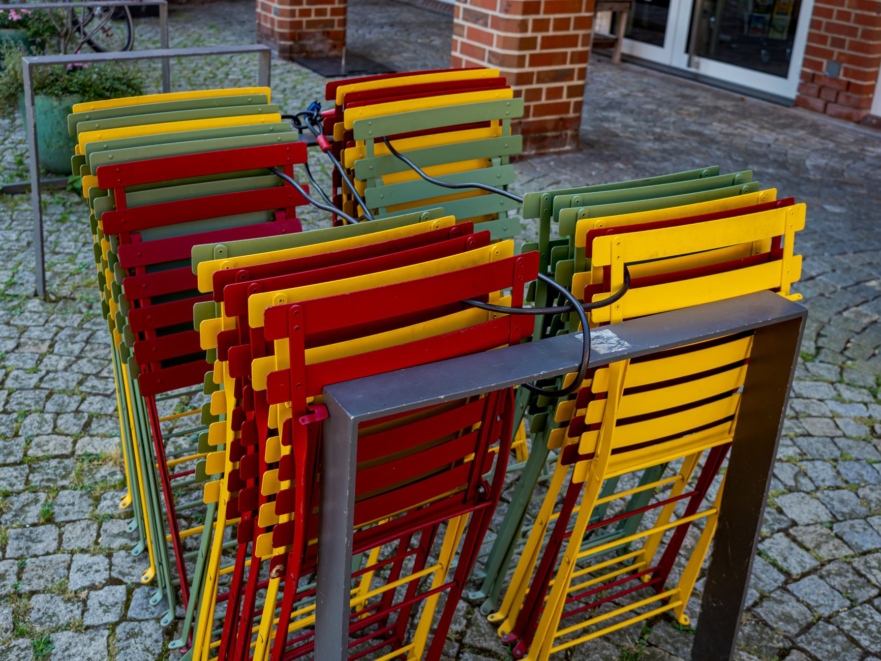 Chairs lifted off the floor in a food-service area, illustrating the kind of repeatable nightly reset that helps an arcade or FEC cleaning program run smoothly.