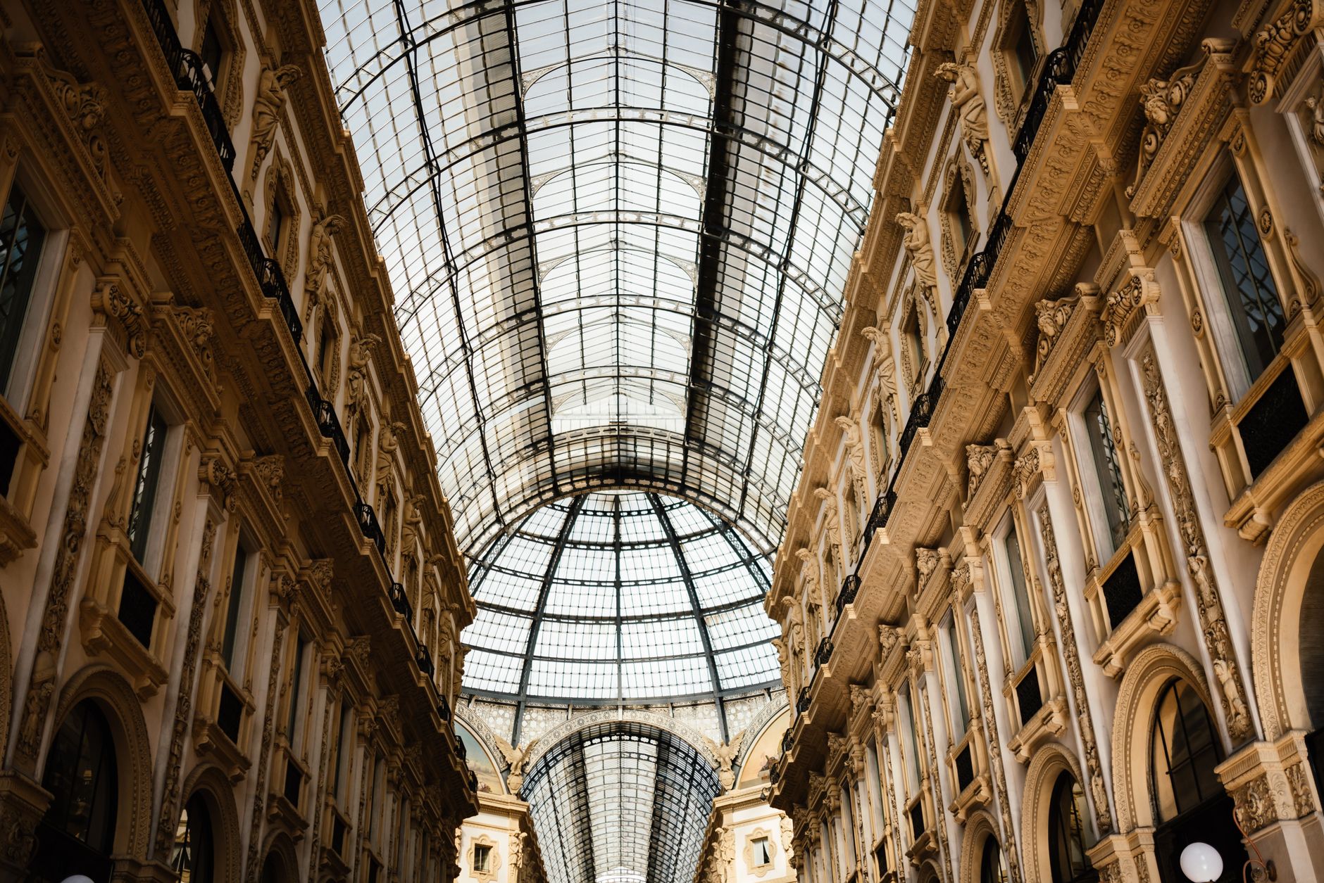 Wide view of a brightly lit arcade interior with hard-floor aisles that would need a consistent overnight cleaning path after close.
