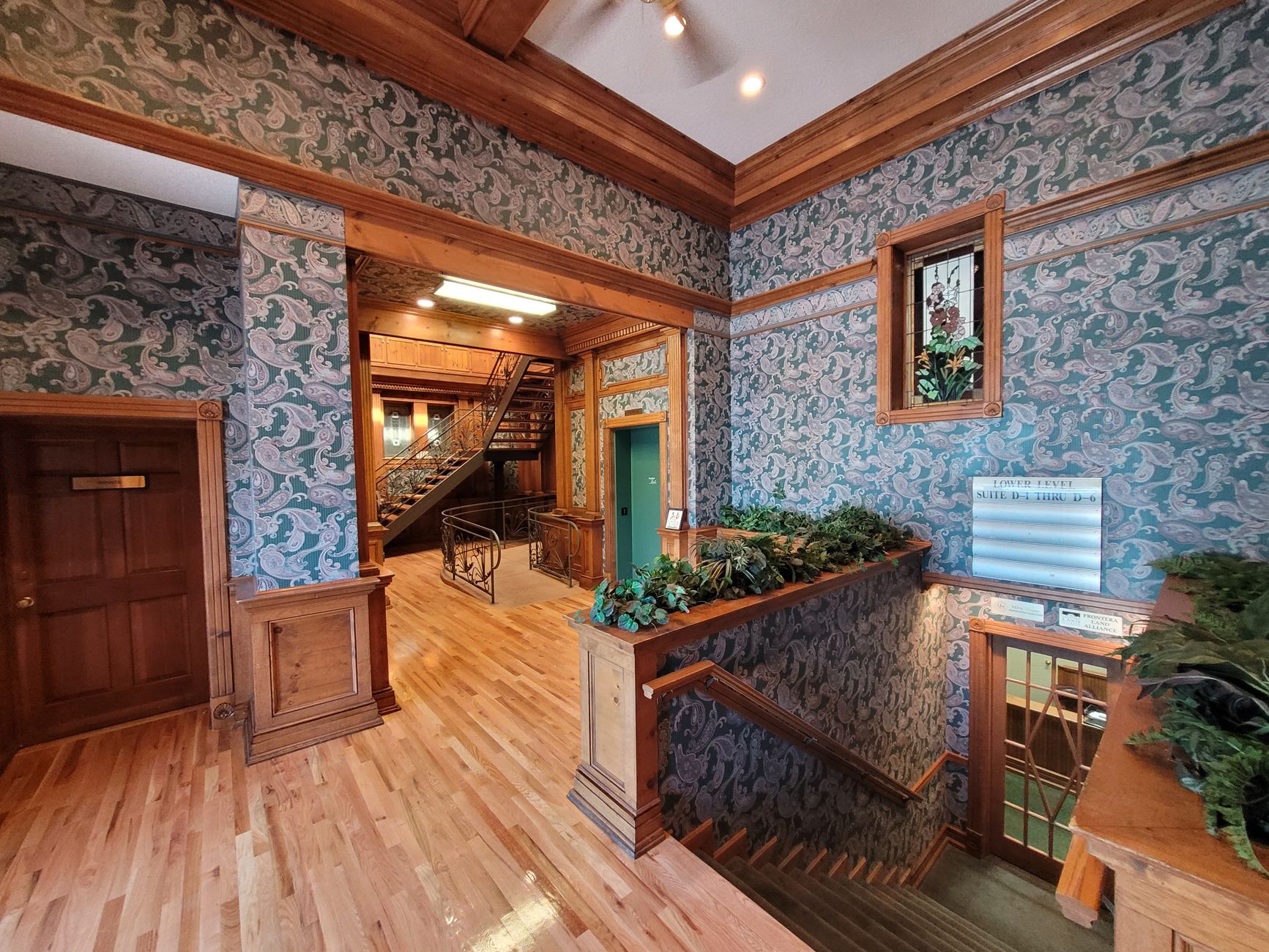 An escape-room venue lobby with open flooring, seating, and themed decor ready for overnight cleaning.