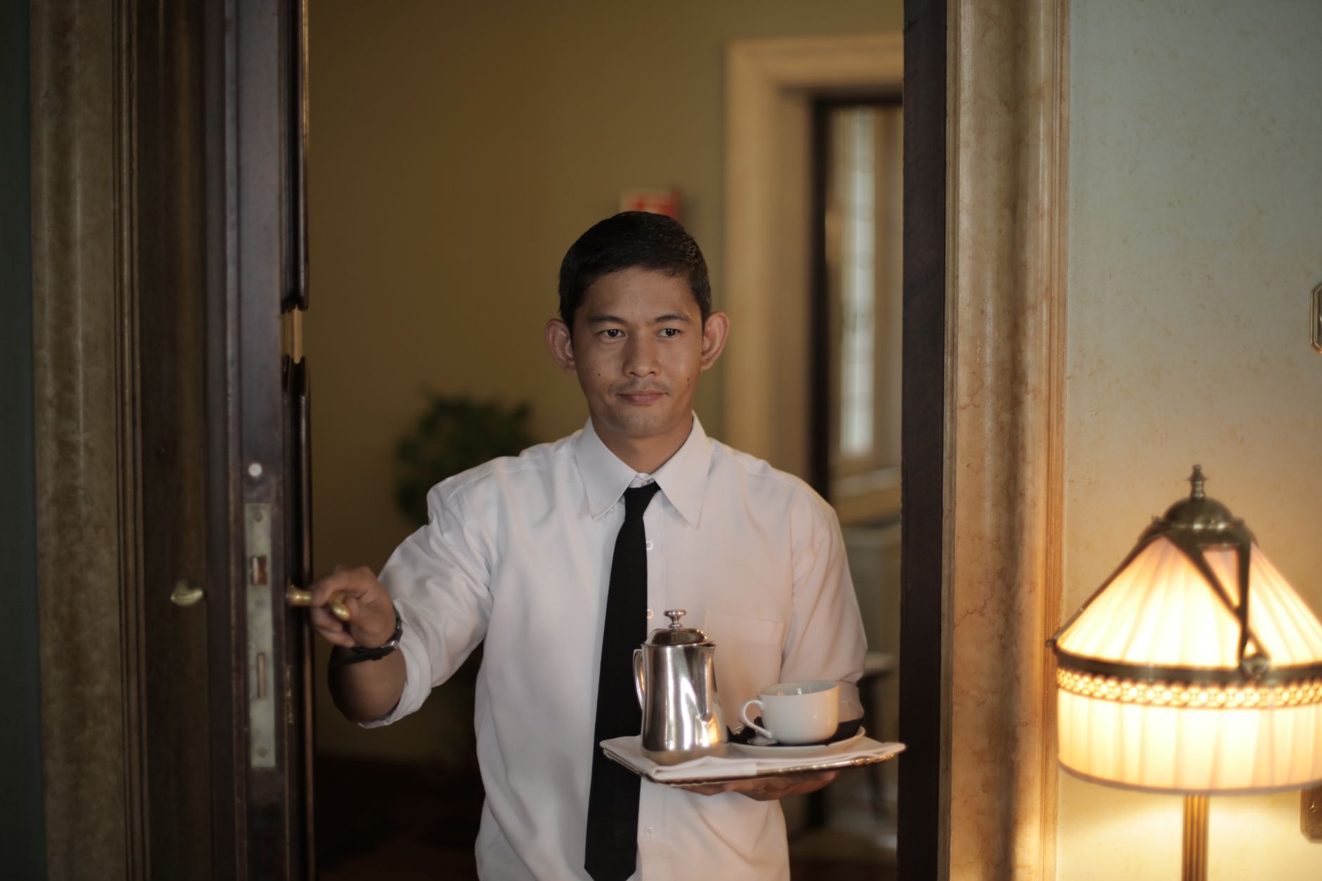 A hotel service entrance represents the difficult handoff points where route completion determines delivery economics.