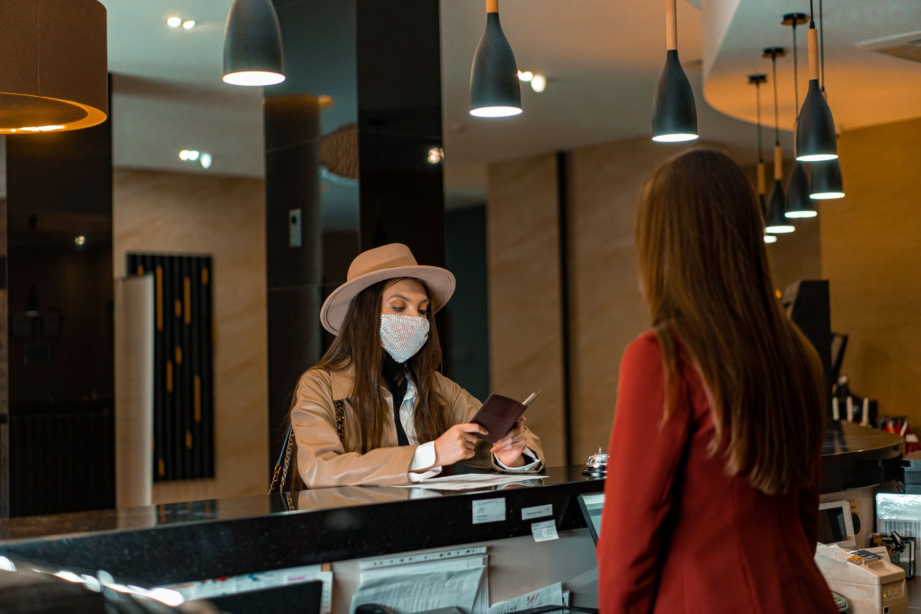 A hotel lobby with guests waiting, illustrating the potential for delays when a resort is understaffed.