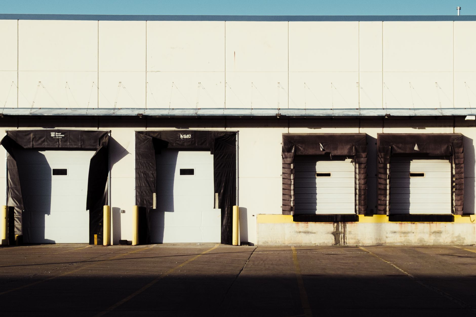 A large loading dock and side service area at a commercial property, where repeat after-hours perimeter checks matter most.