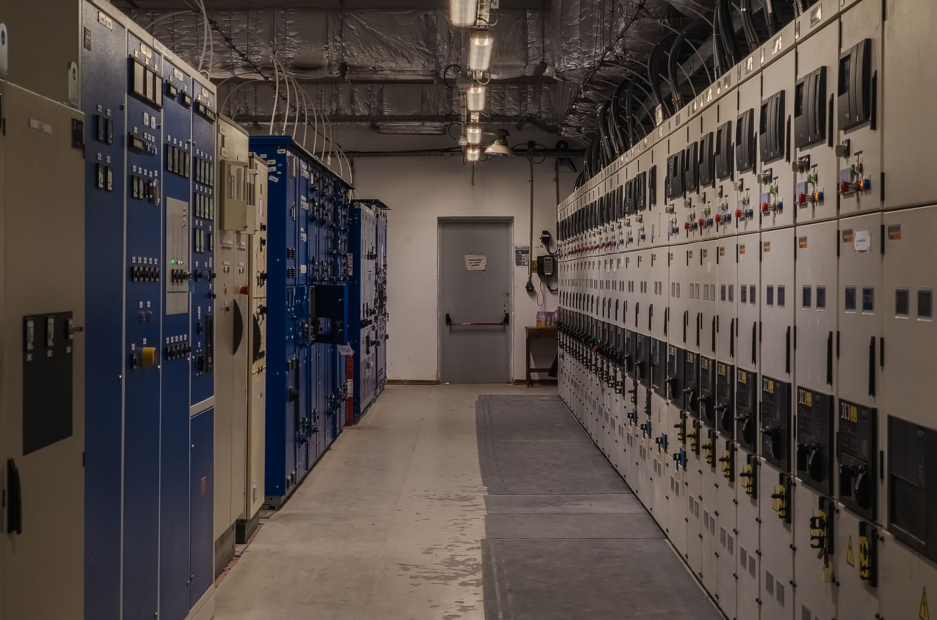 A secured electrical room inside an industrial building, highlighting the interior infrastructure that still depends on locks and physical hardening.