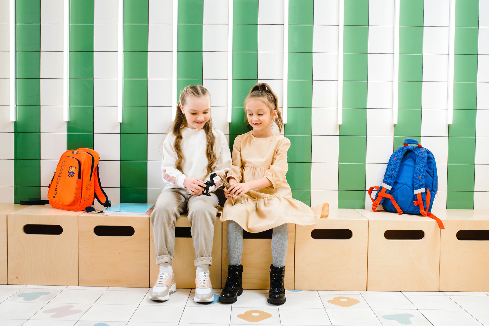 A busy childcare hallway with cubbies, bags, and shifting obstacles that illustrate why short, restartable cleaning windows matter.