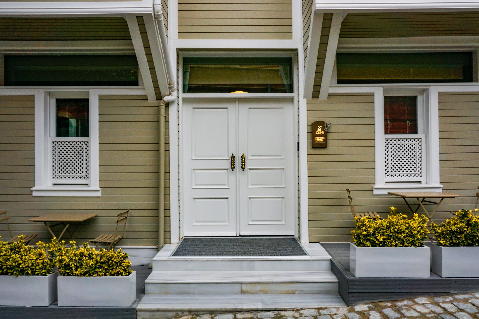 Close view of a commercial doorway threshold and floor transition that would matter during a branch site survey.