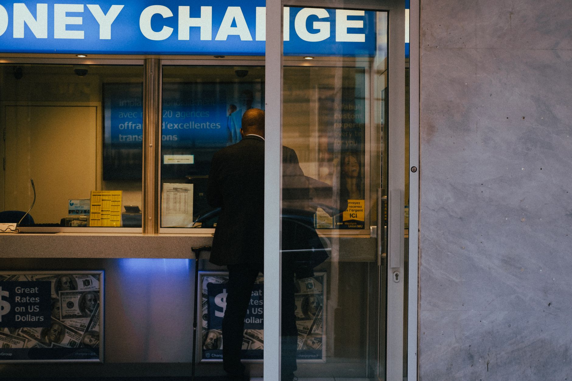 Clean, modern bank branch lobby with open hard floors, seating, and clear walking paths.