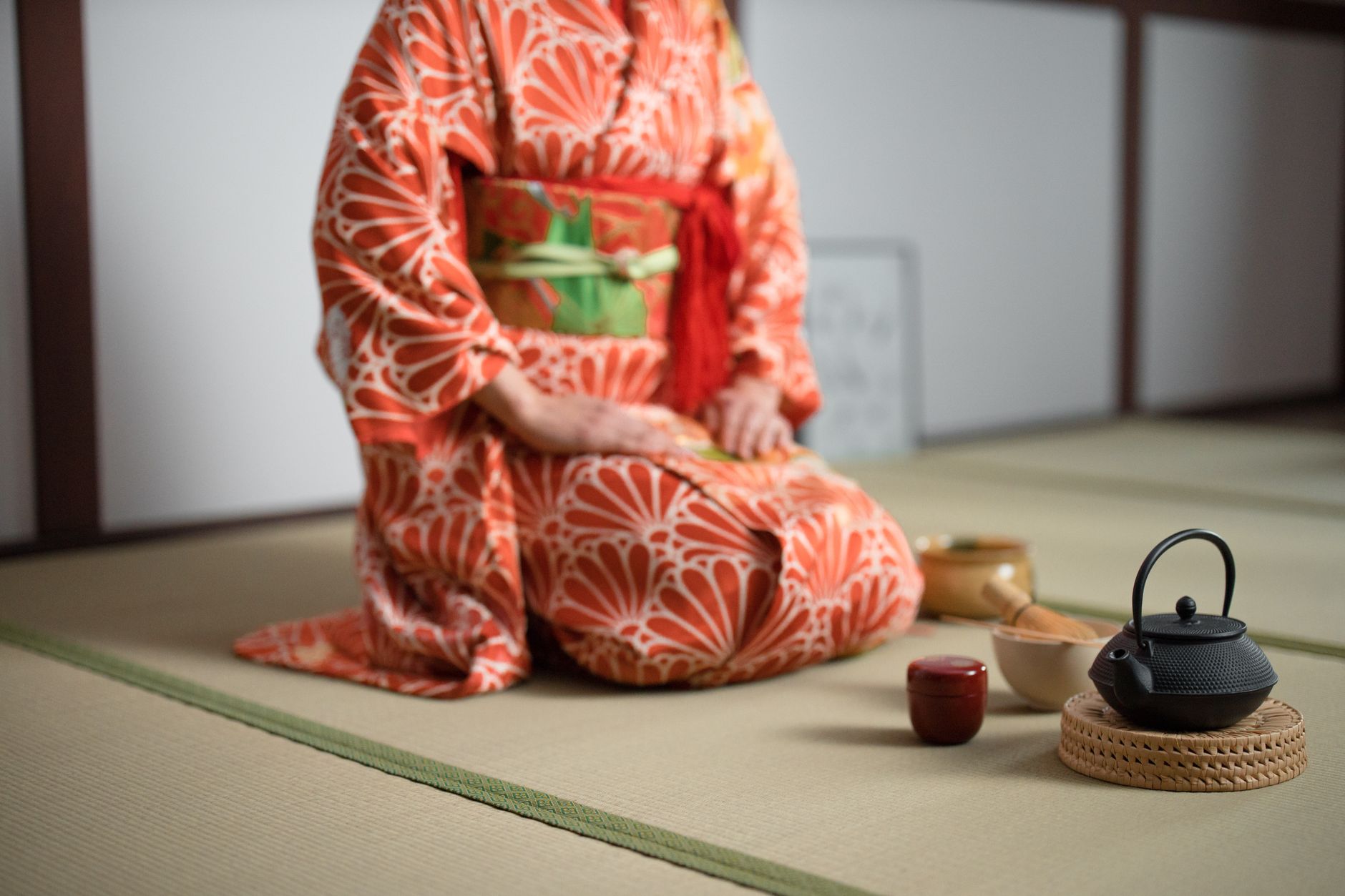 Close view of textured martial arts mats showing the seams between padded sections.