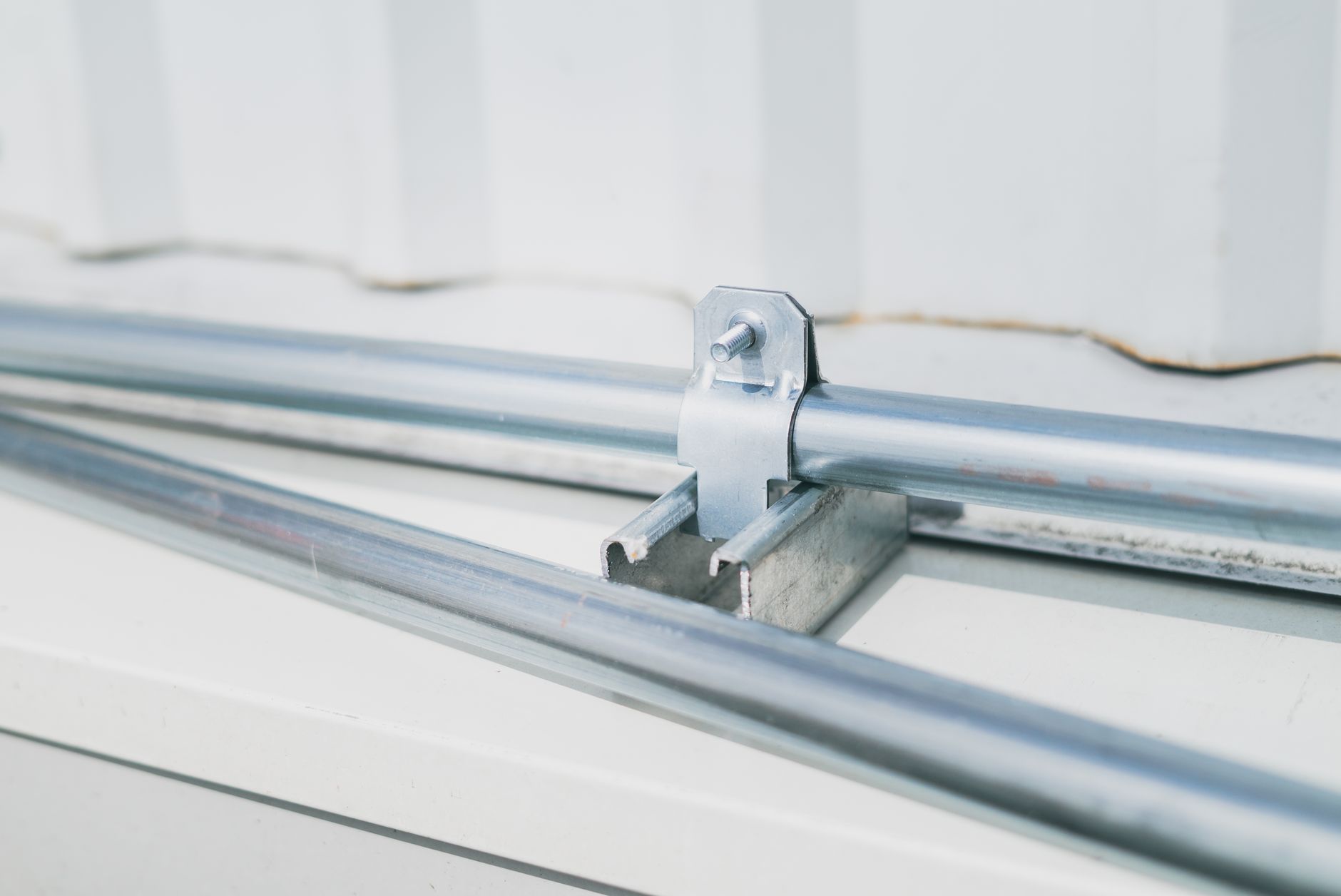 A grounding clamp grips bare metal to provide an electrical path to ground.