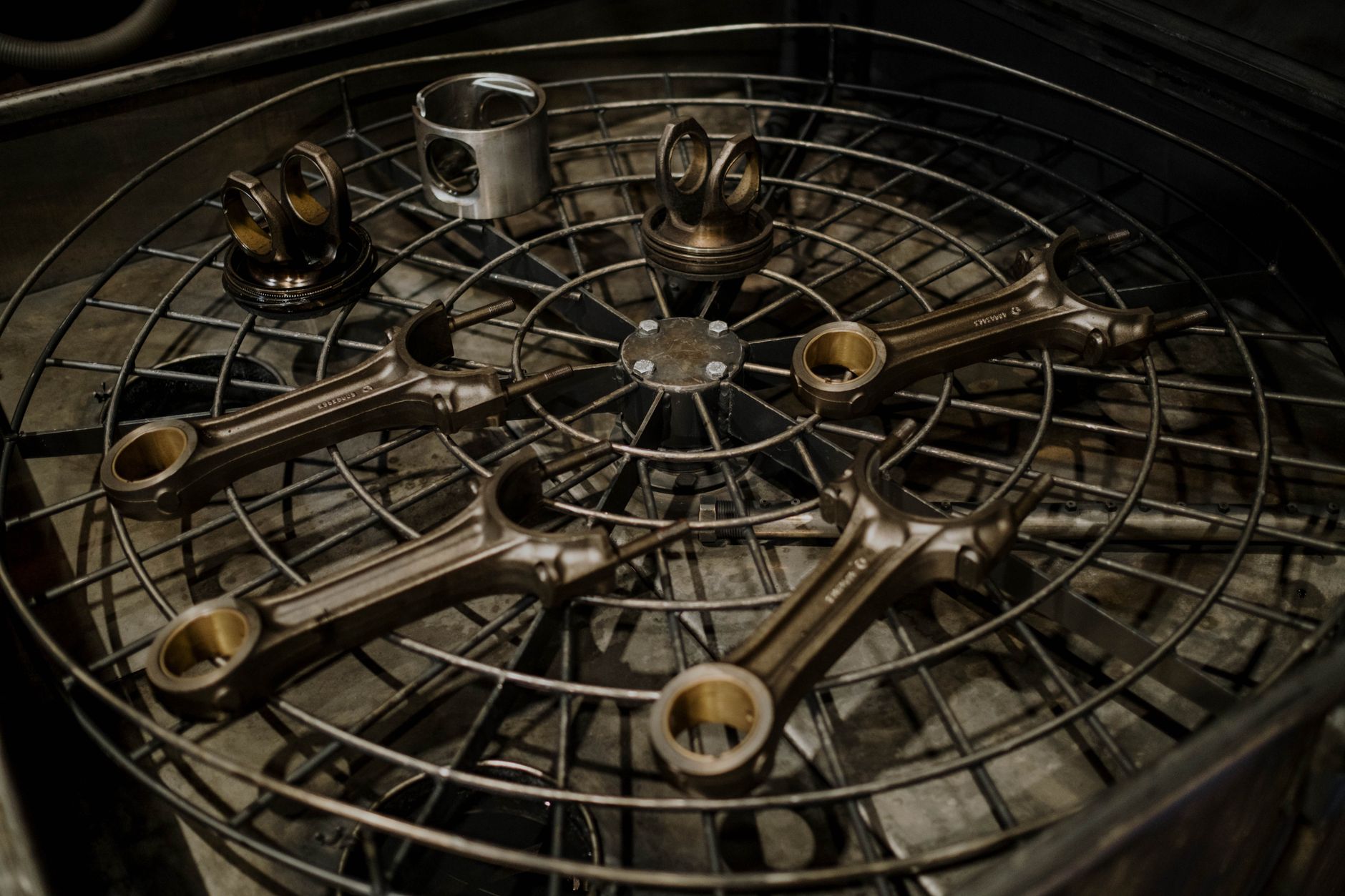 Metal components are cleaned before entering a powder-coating finishing process.