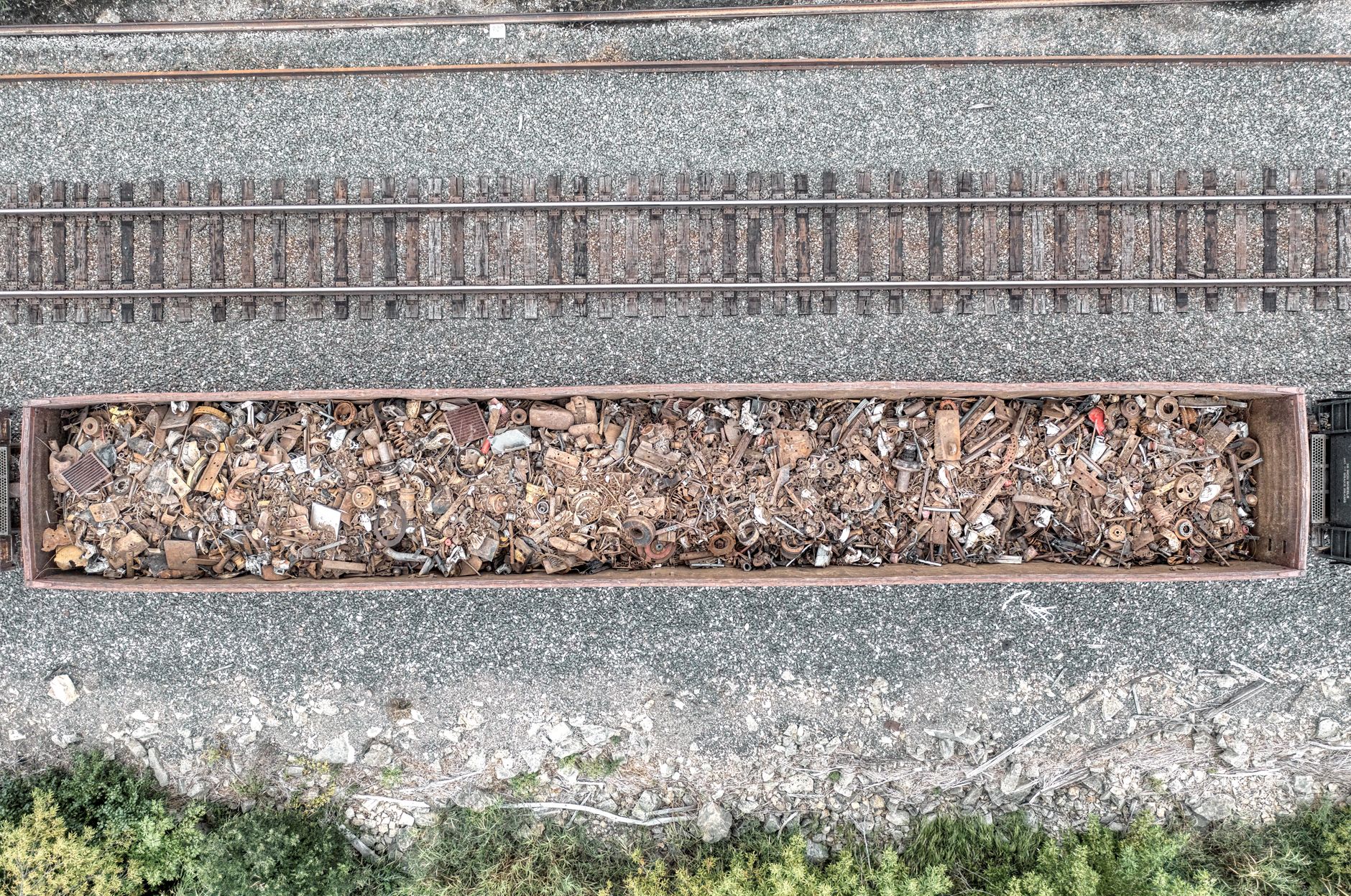 Rough gravel and mud surfaces that patrol robots must climb without bogging down.