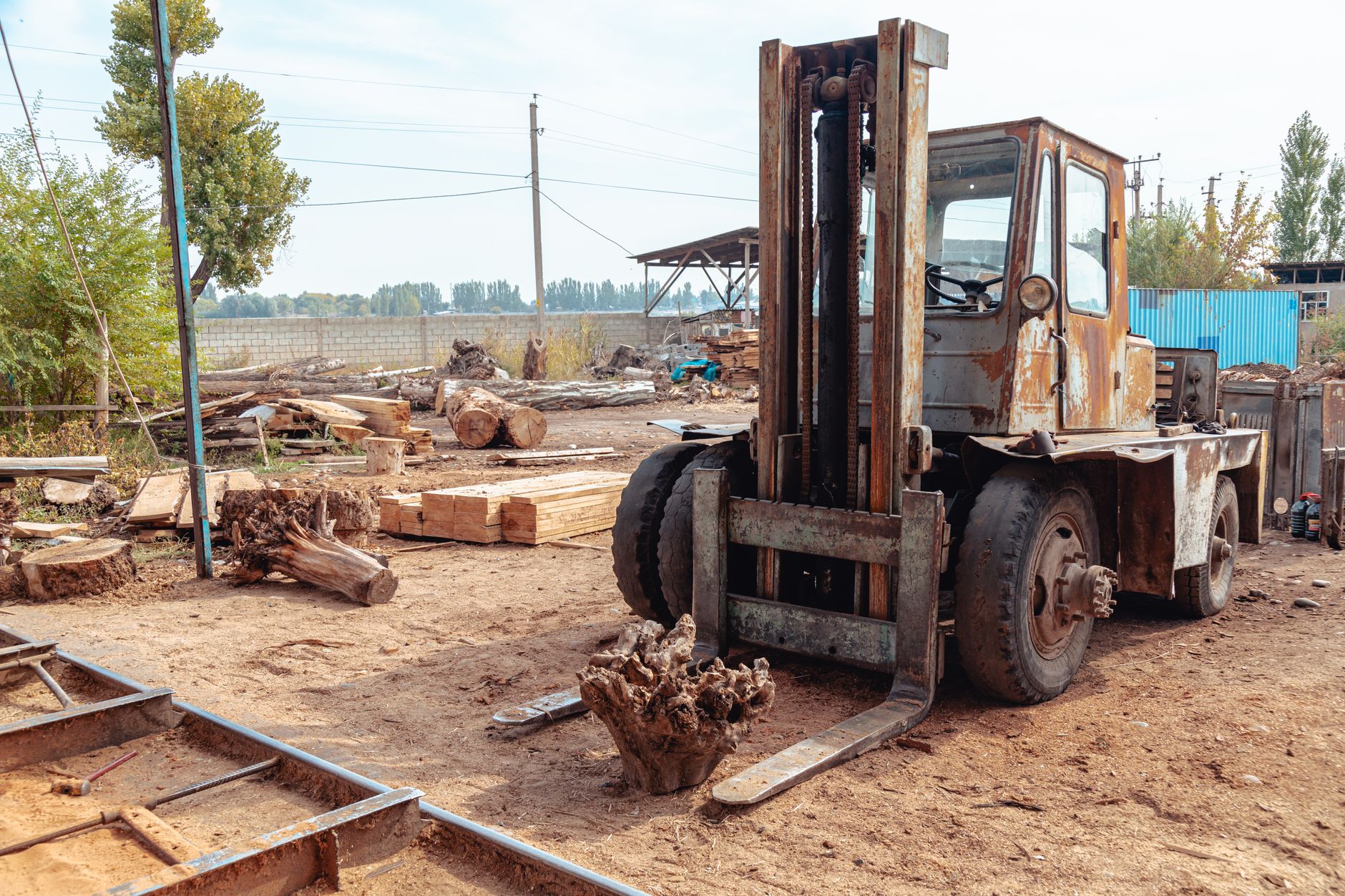 A forklift moving material through aisles that patrol geofences must respect.