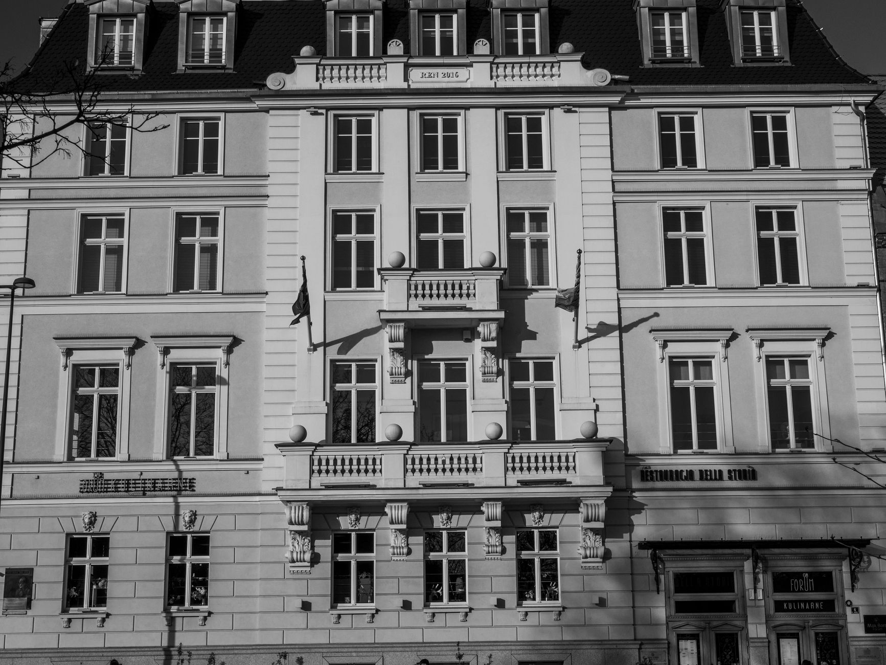 A thermal imaging view of a commercial building's exterior, showing heat variations that indicate potential insulation issues invisible to the naked eye.