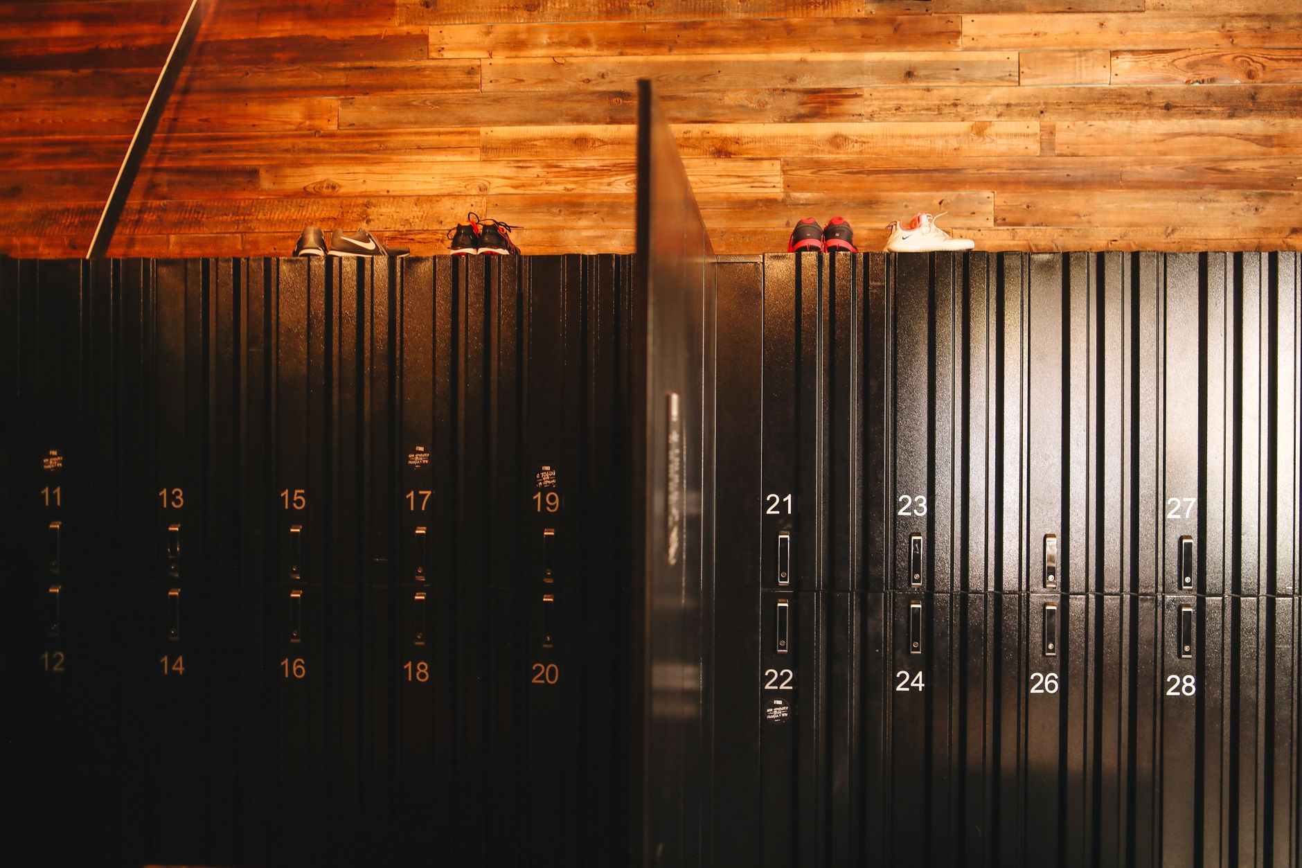 A clean and modern gym locker room, illustrating the detailed cleaning work human staff can focus on.