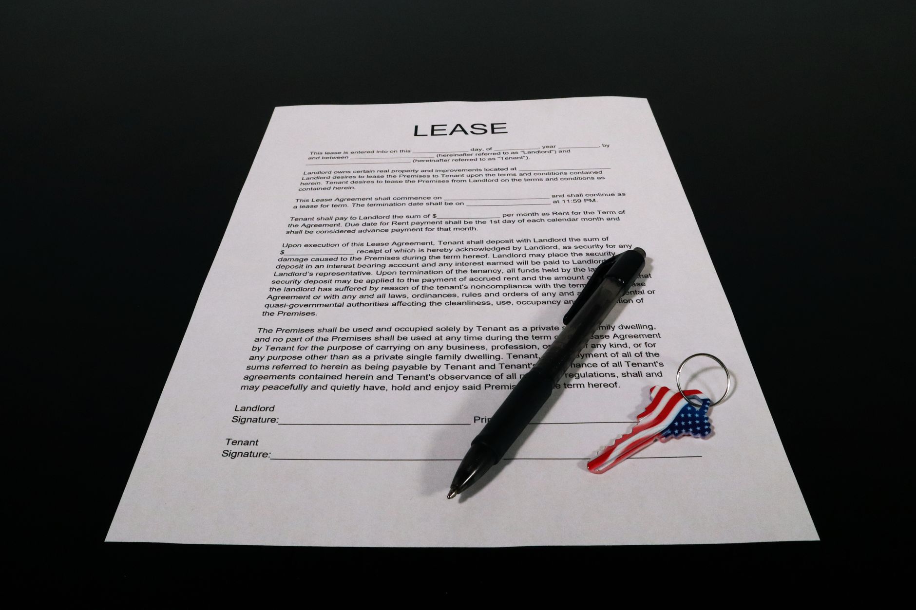 A franchise operator reviewing lease paperwork at a desk before comparing what support is and is not included in the monthly agreement.