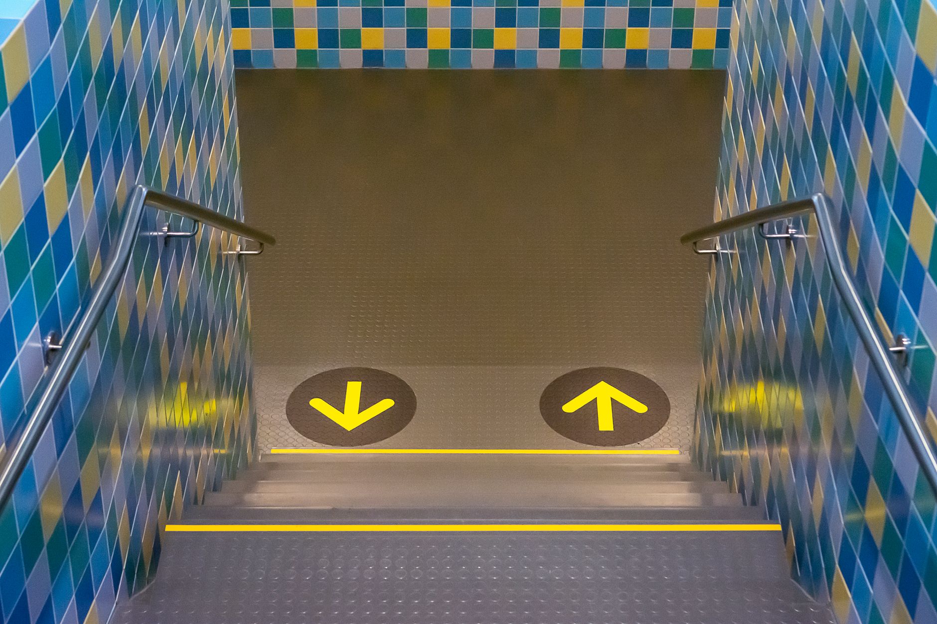Yellow safety lines on a industrial floor that should appear as no-cross zones on a robot map.