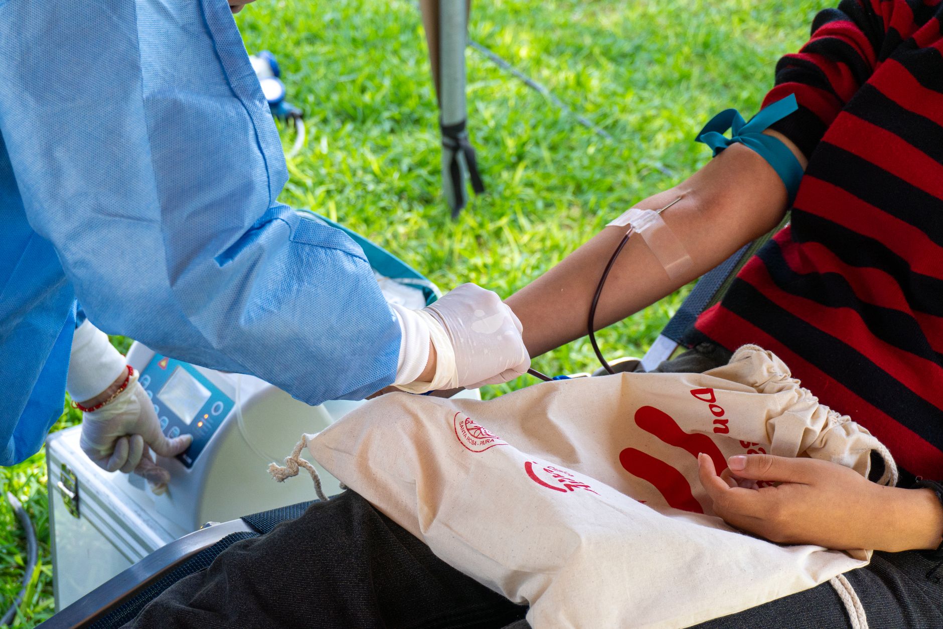 Donation chairs and nearby clinical equipment arranged within a blood collection room.