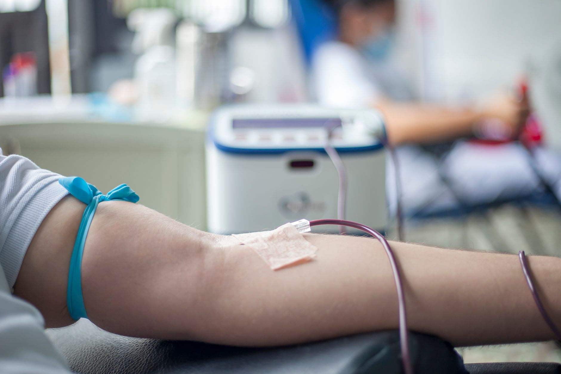 A calm blood donation center with donor chairs and clear floor space for safe circulation.