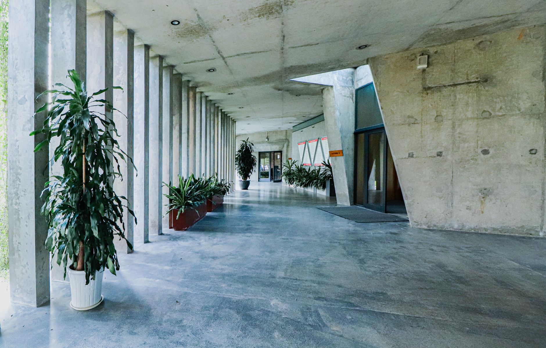 A quiet indoor hallway with polished concrete floors that show how cleanliness shapes the feel of a climate-controlled storage building.