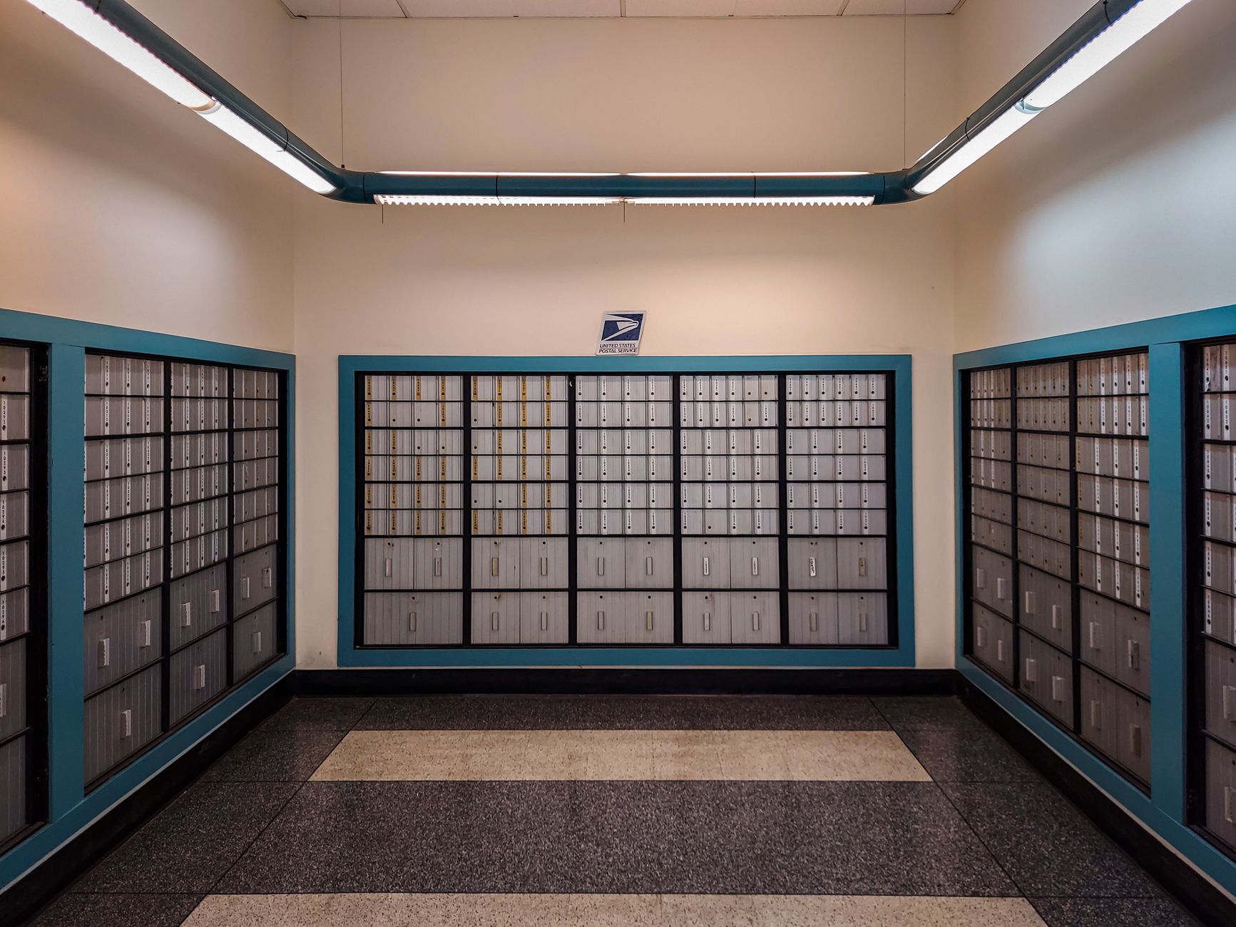 A controlled-access office corridor illustrates the secure areas that floor-cleaning routes must avoid.