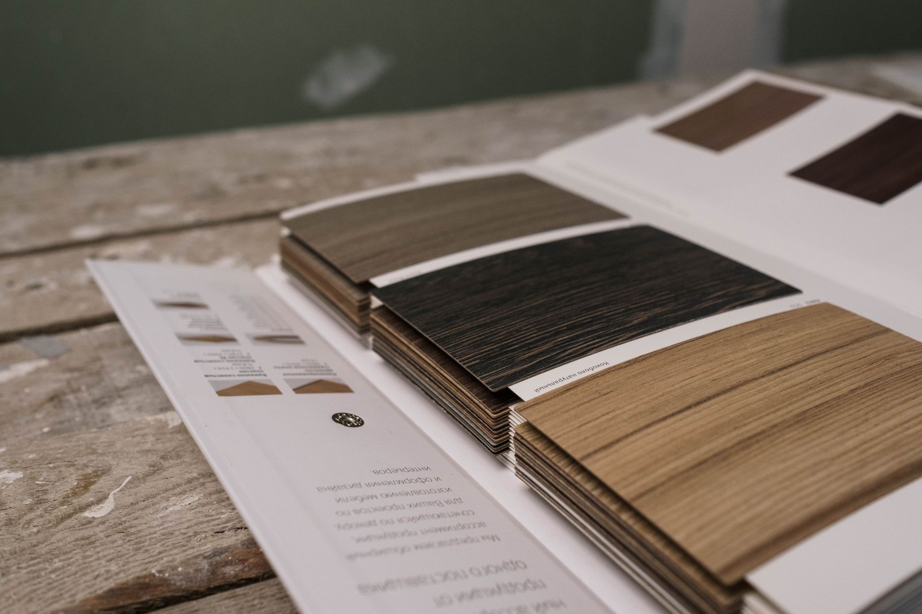 Rows of wood, tile and resilient flooring samples illustrate the different finishes and moisture tolerances found in a mixed-floor showroom.