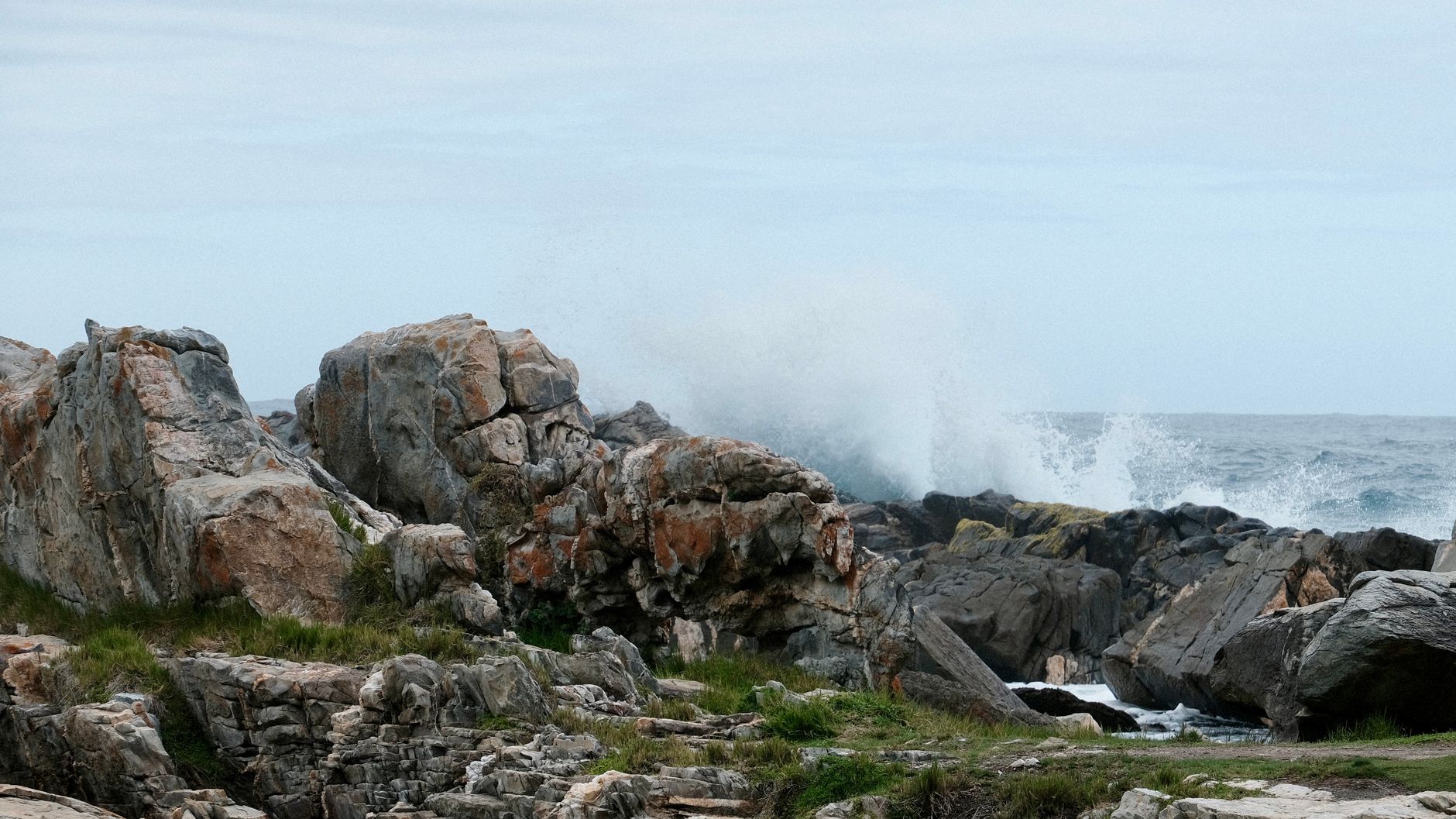 Coastal shoreline with salt spray, evoking corrosion exposure near marina facilities.