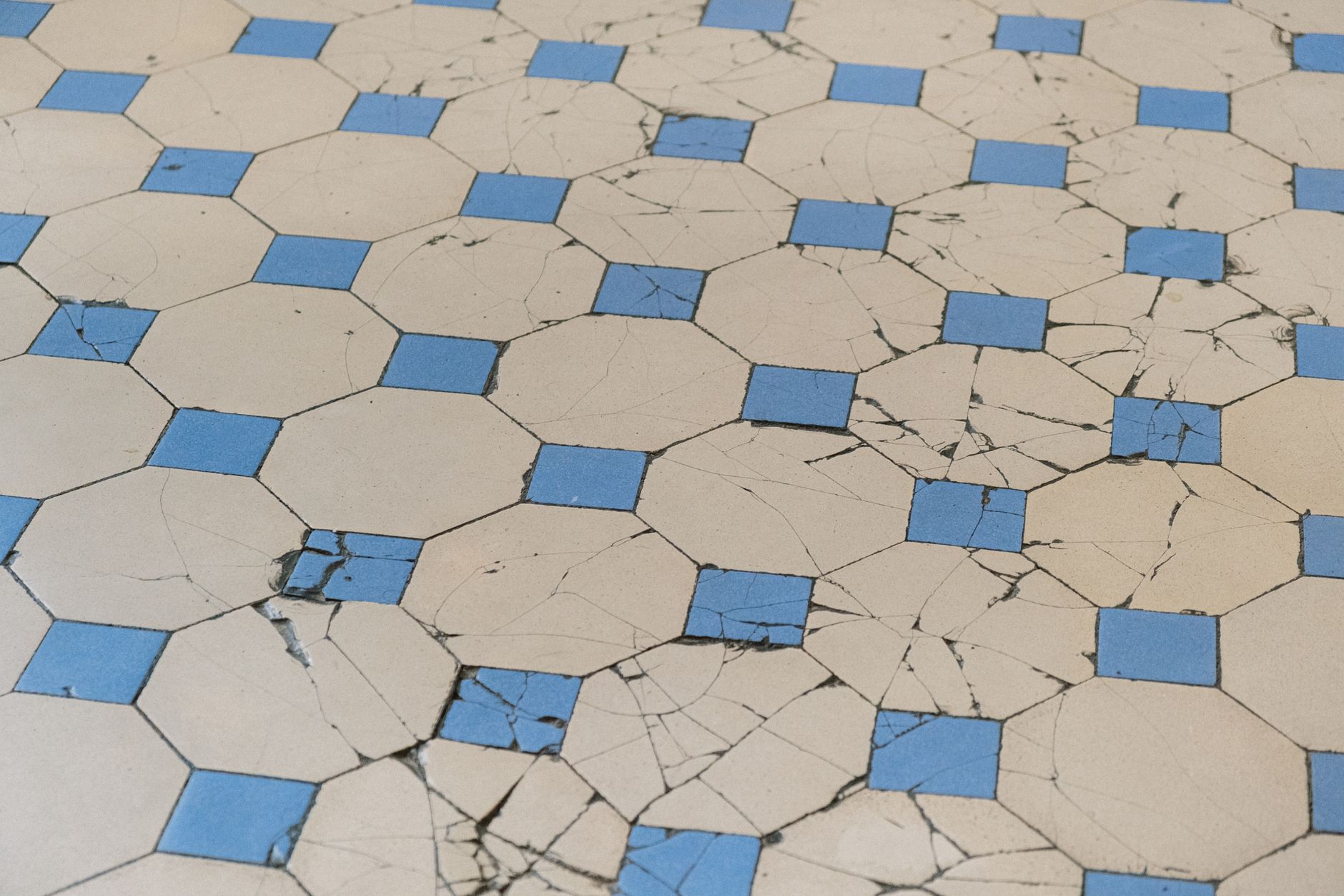 A close-up view of a clean, conductive tile floor typical of an area where electrostatic discharge is a concern.