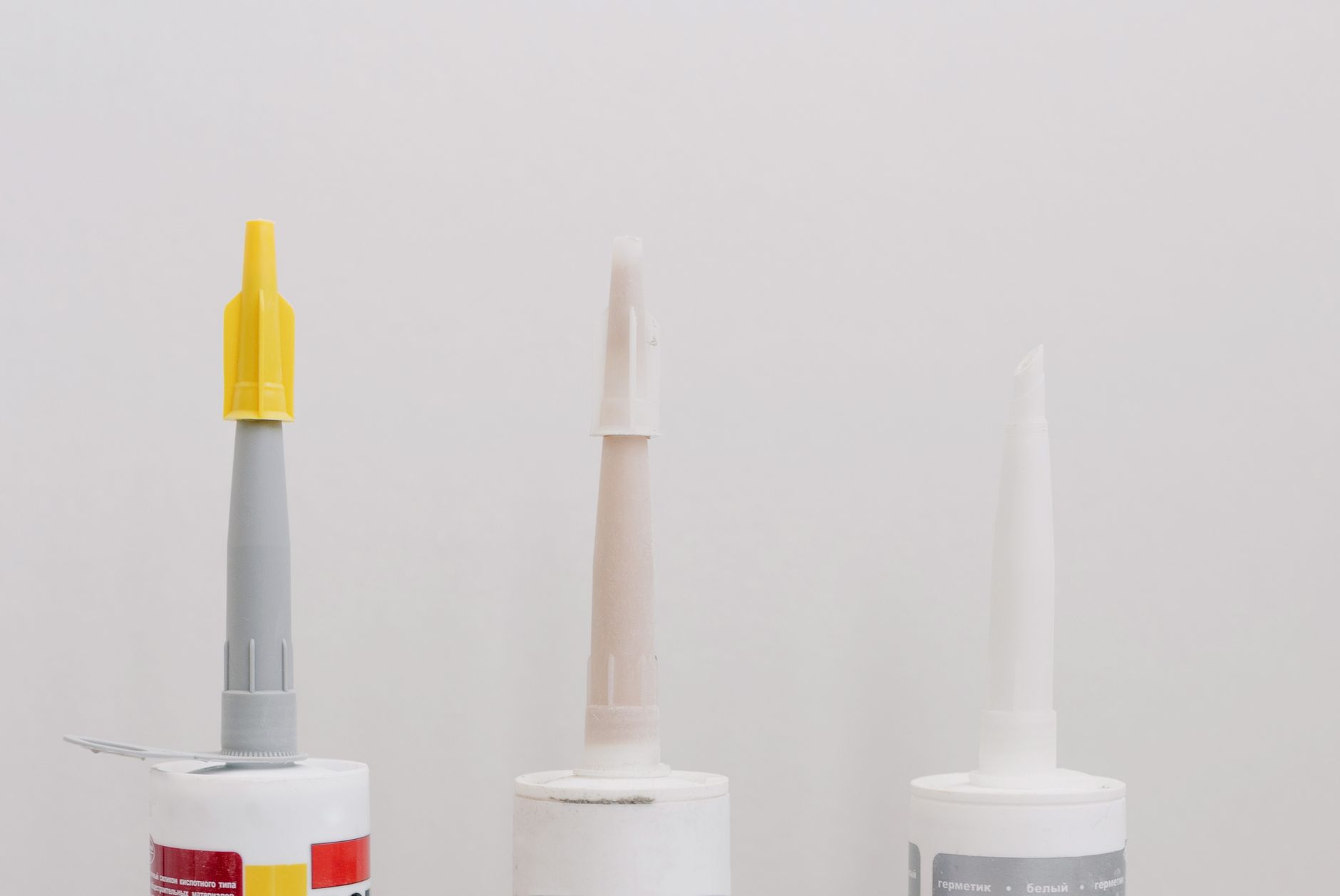 A dispensing nozzle lays a continuous sealant bead on a manufactured part.