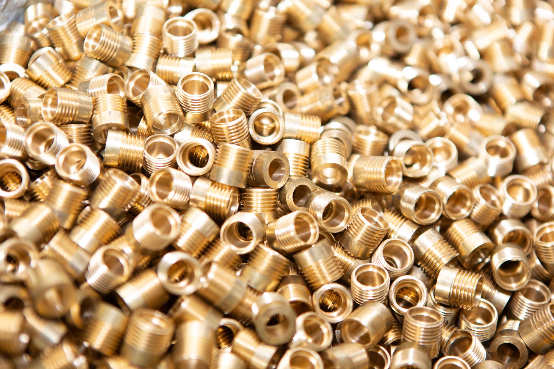 A close view of a machined metal part seated in a precision workholding fixture.