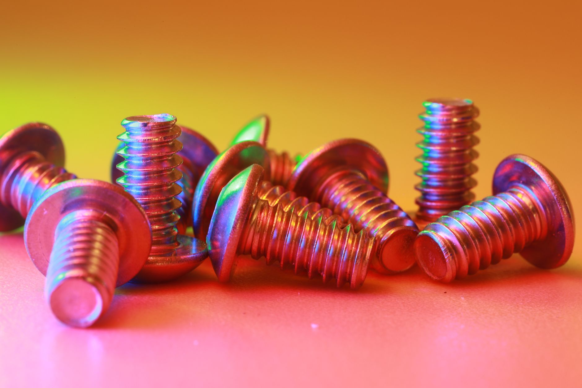 Glowing steel parts radiate heat while cooling inside an industrial workshop.