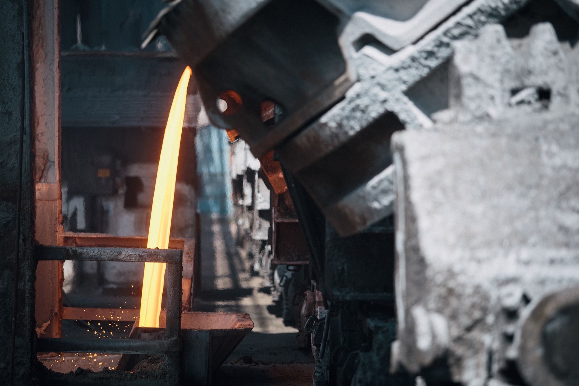 Protected industrial cables run through heat-resistant sleeving near hot equipment.