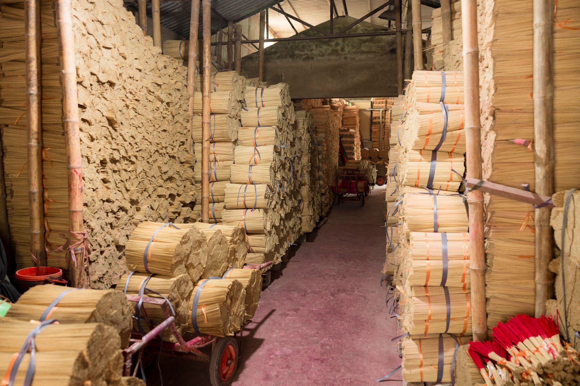 A narrow workshop aisle shows why equipment footprint and access space matter in a crowded machine shop.