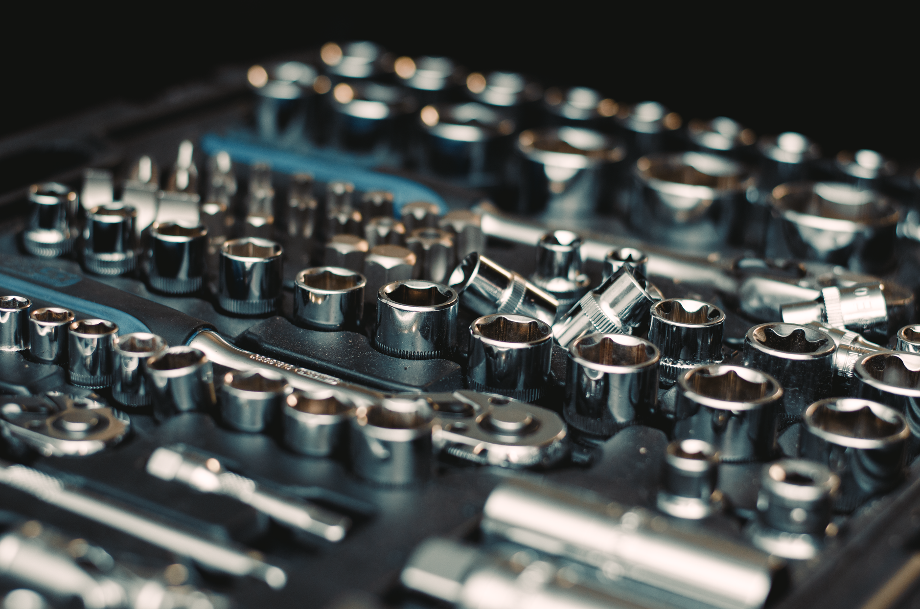 An organized socket and hand-tool set suggests the bit, setup, and recipe changes that drive changeover effort on fastening stations.